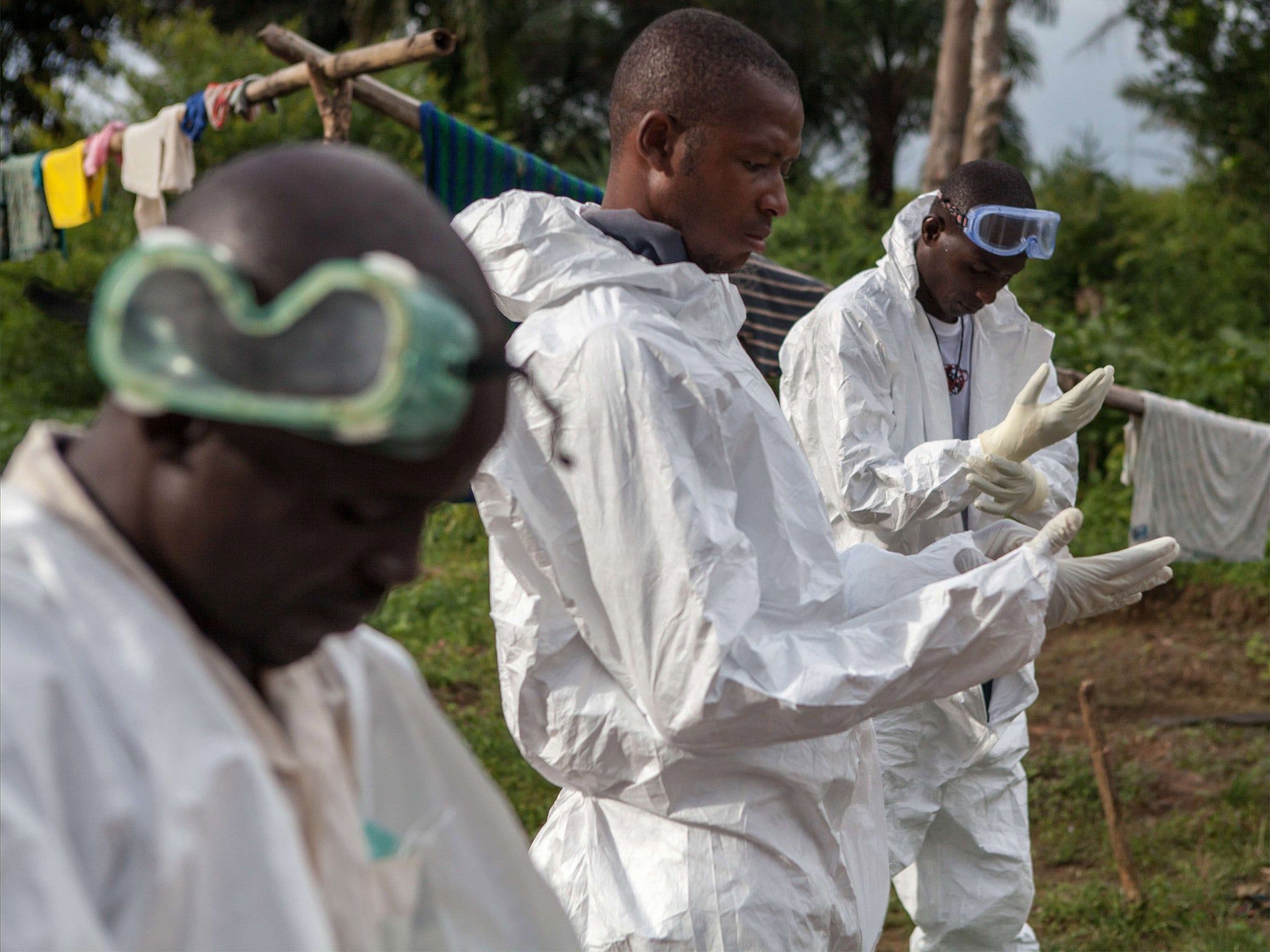 A specialised Ebola inhumation team (Getty)