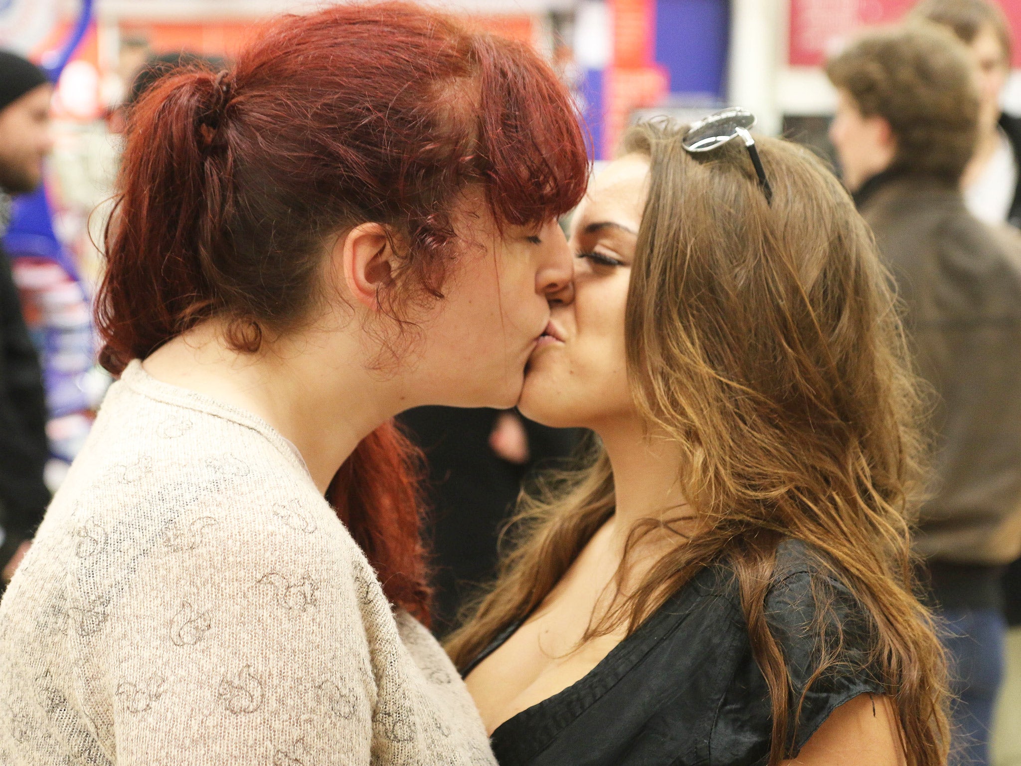 Students kiss to protest the eviction of Annabelle Paige at a Sainsbury’s store in Brighton