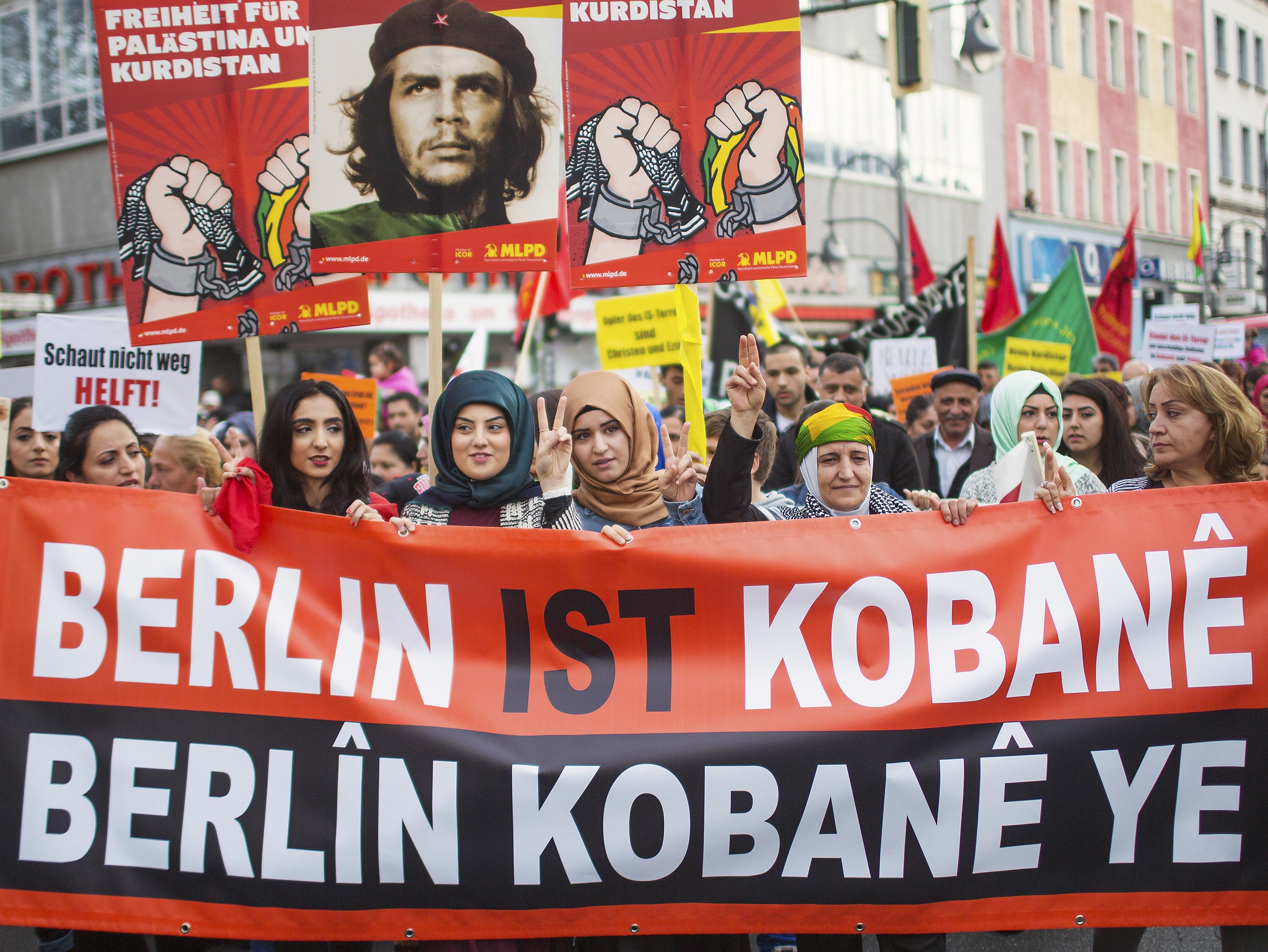 Protesters march in Berlin against Islamic State attacks on Syrian Kurdish town of Kobani