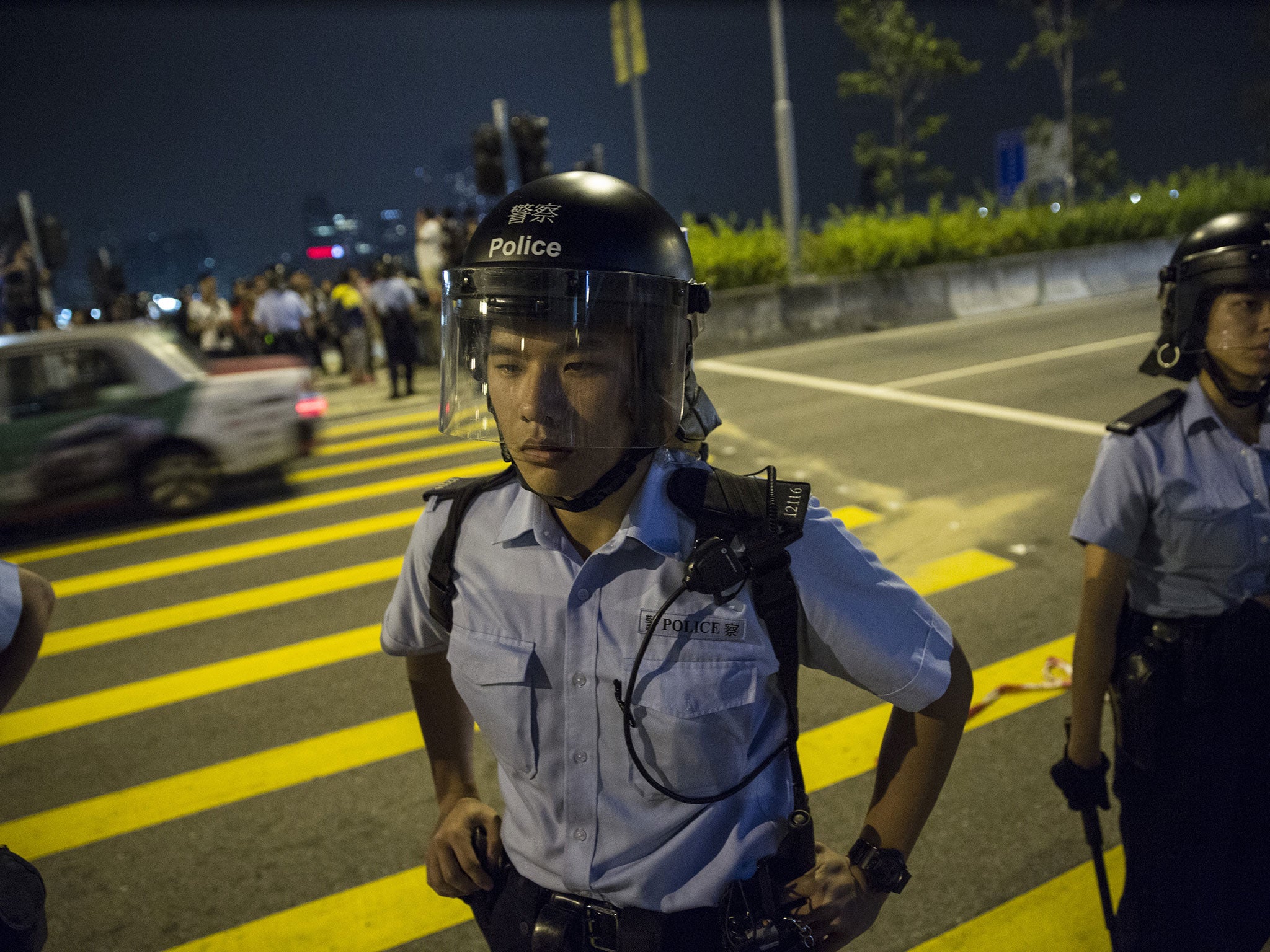 Police block roads to stop protesters as scuffles break out between the two sides (Paula Bronstein/Getty Images)