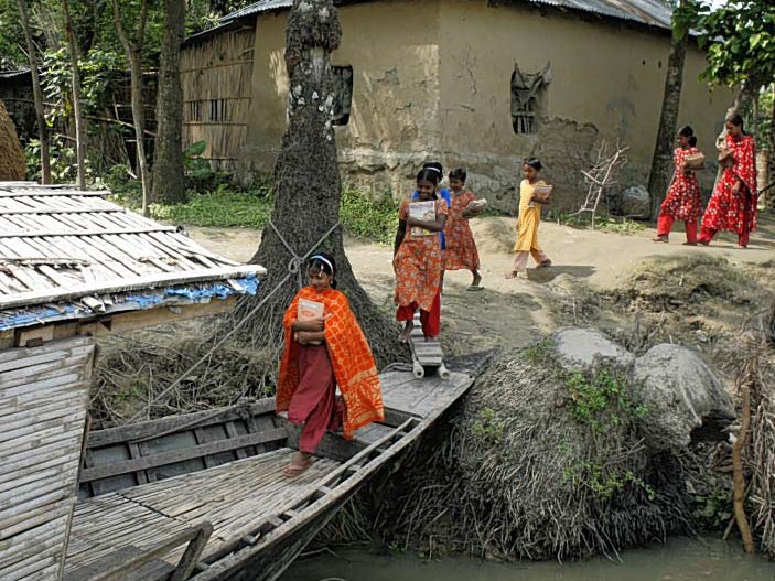 One project brings boat tuition to Bangladeshi students solar powe red fl oatin g schools