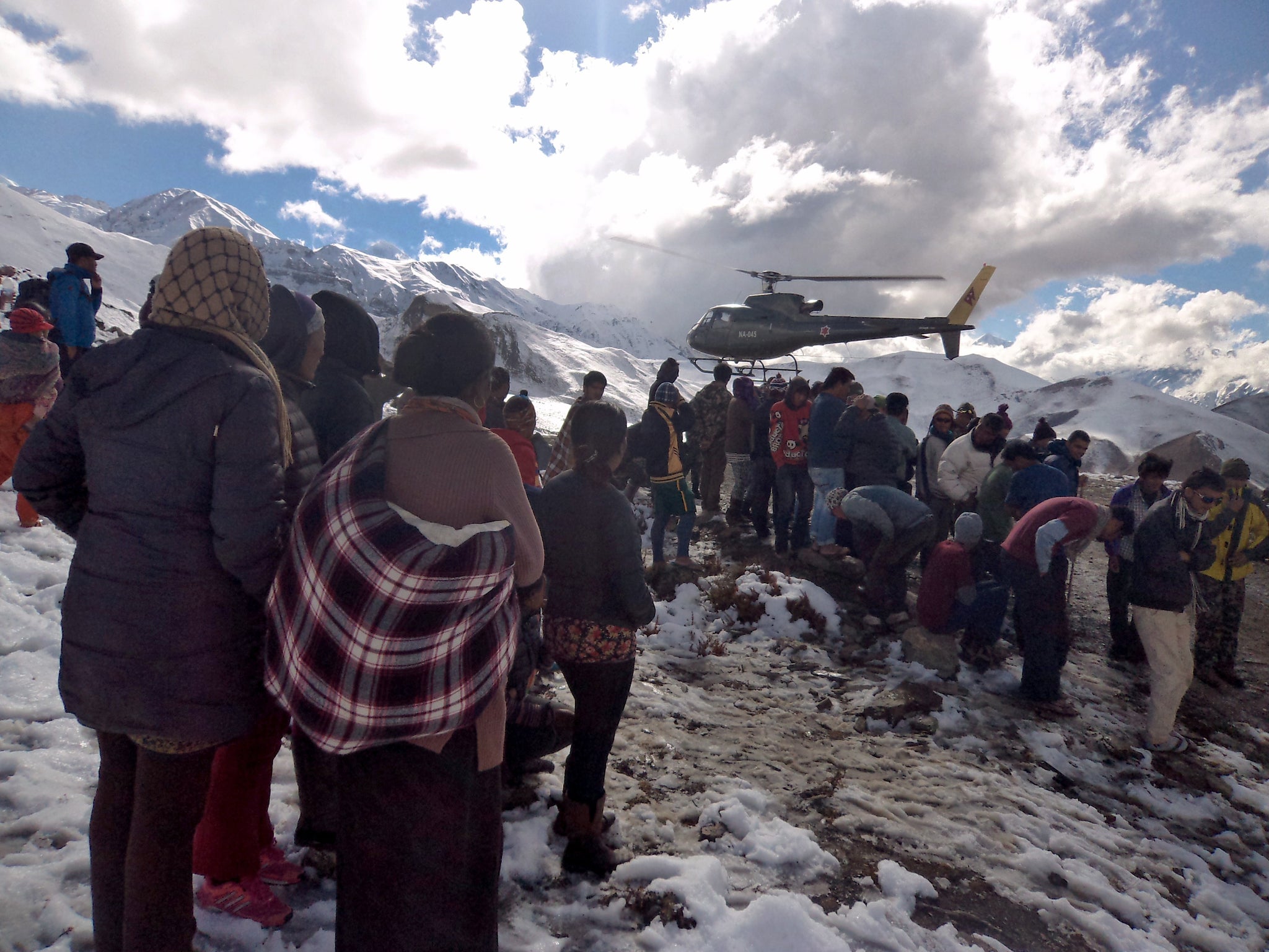 A Nepalese army helicopter rescues survivors on the Annapurna trail