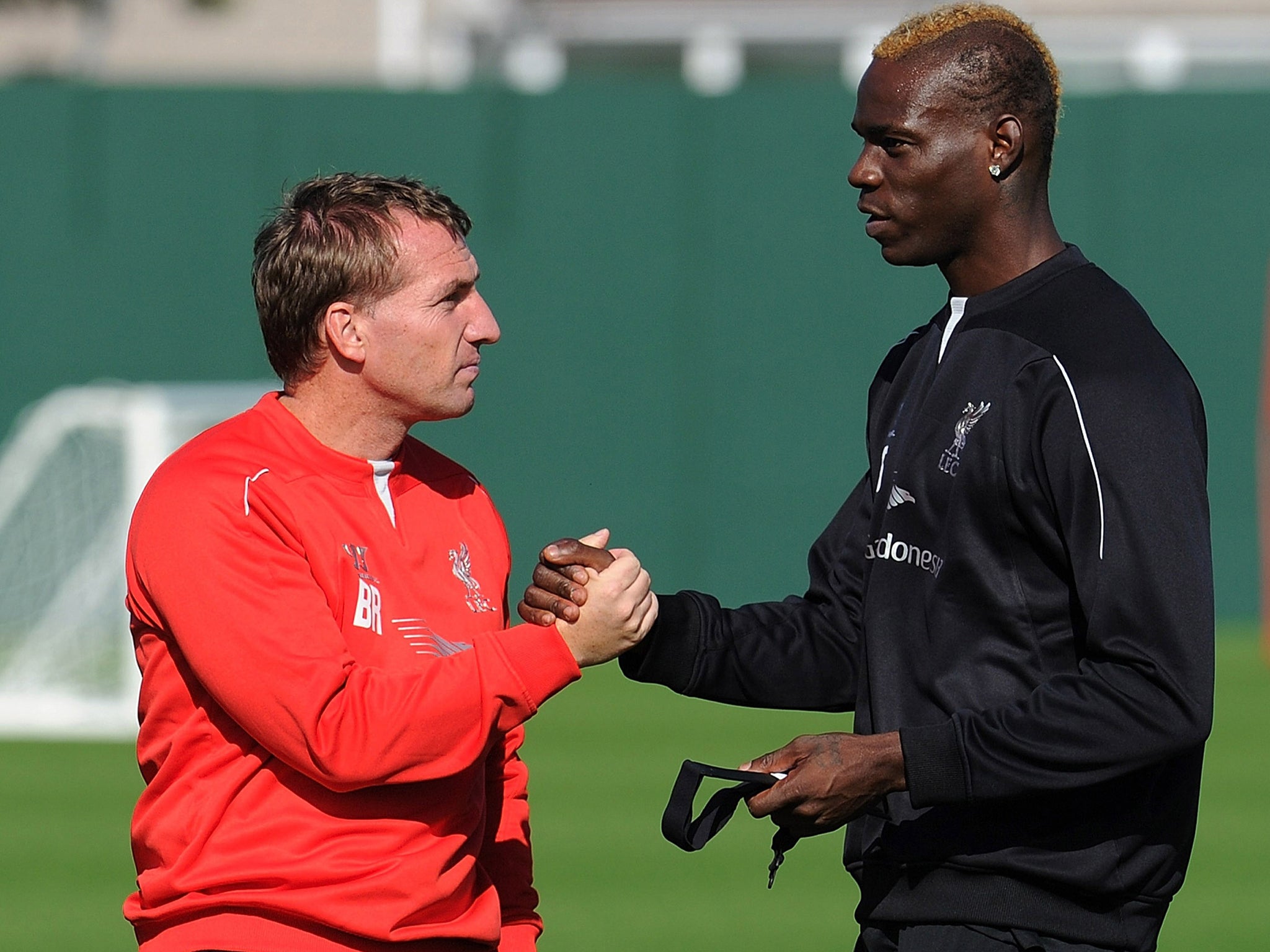 Mario Balotelli says manager Brendan Rodgers plays him as a lone striker for Liverpool while he is used to two
up front