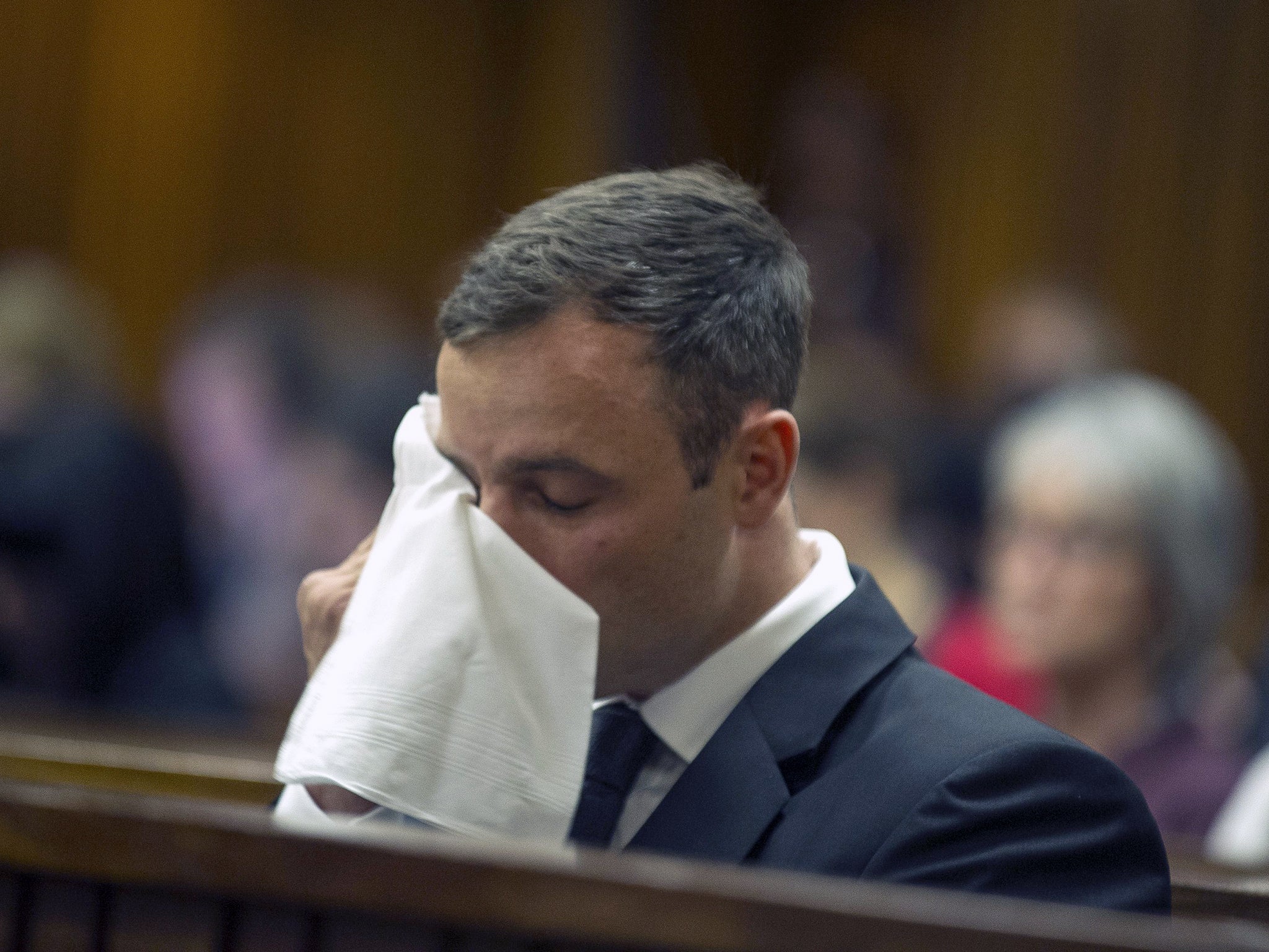 Oscar Pistorius wipes tears during his fifth day of sentencing hearing at the North Gauteng High Court in Pretoria