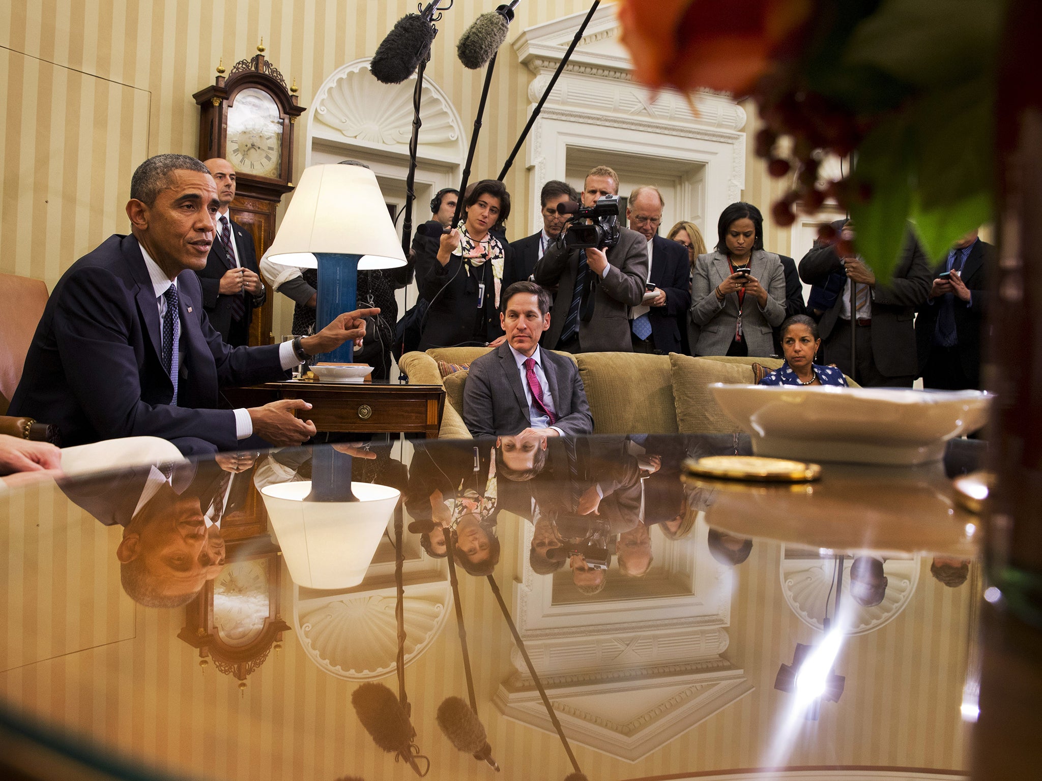 Barack Obama with Centres for Disease Control director Thomas Frieden and National Security Adviser Susan Rice in the Oval Office yesterday