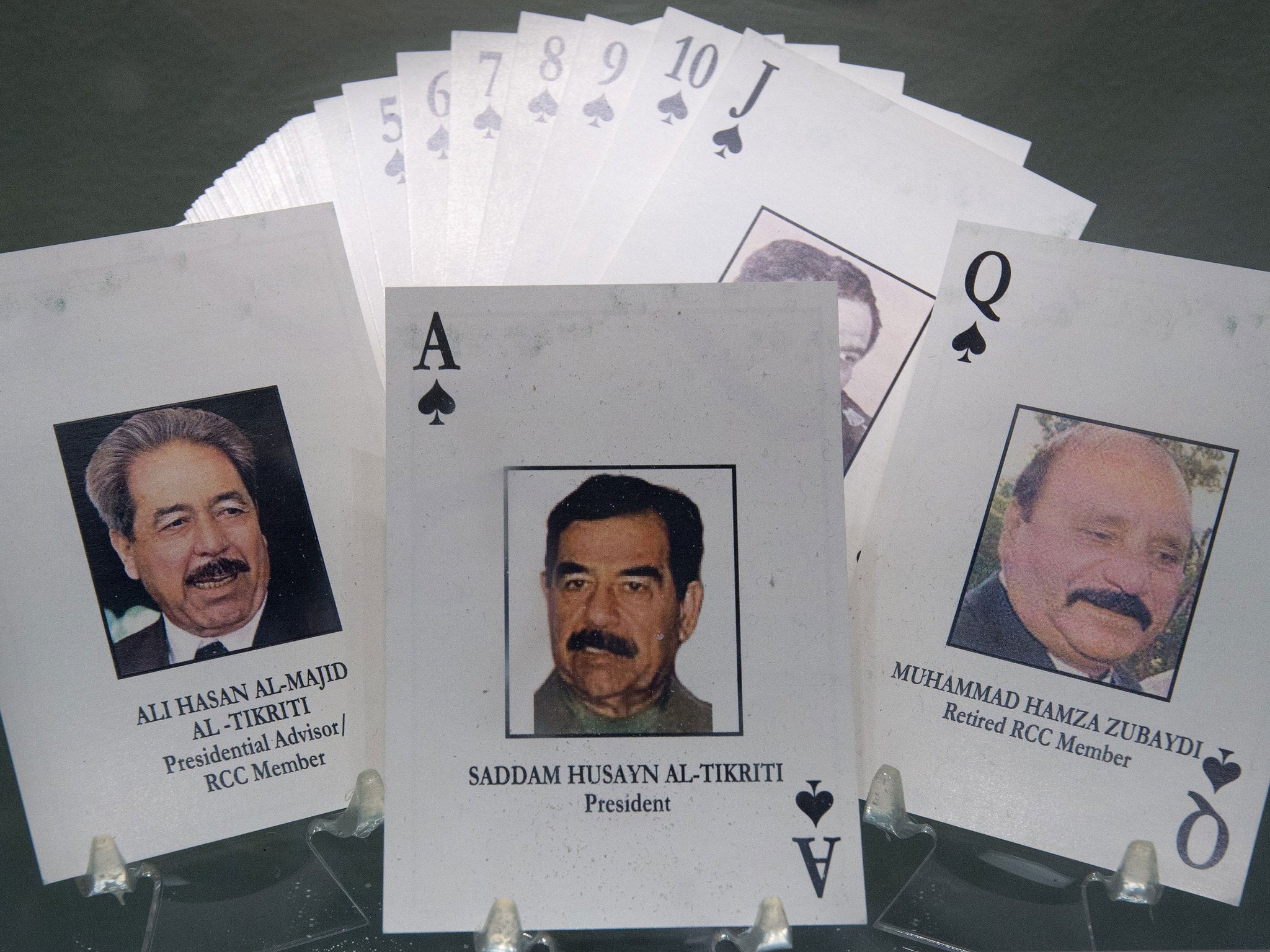 The deck of 52 Most-Wanted Iraqi Playing Cards from Operation Iraqi Freedom are seen October 17, 2014 in a display case at the Pentagon in Washington, DC.