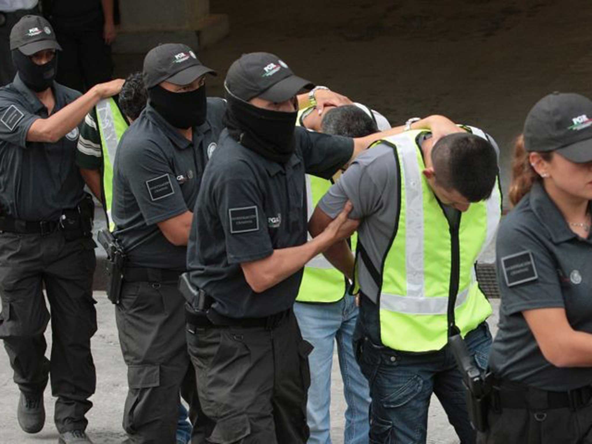 Federal Policemen escort 36 municipal policemen after they were arrested at the General Attorney Office head quarters