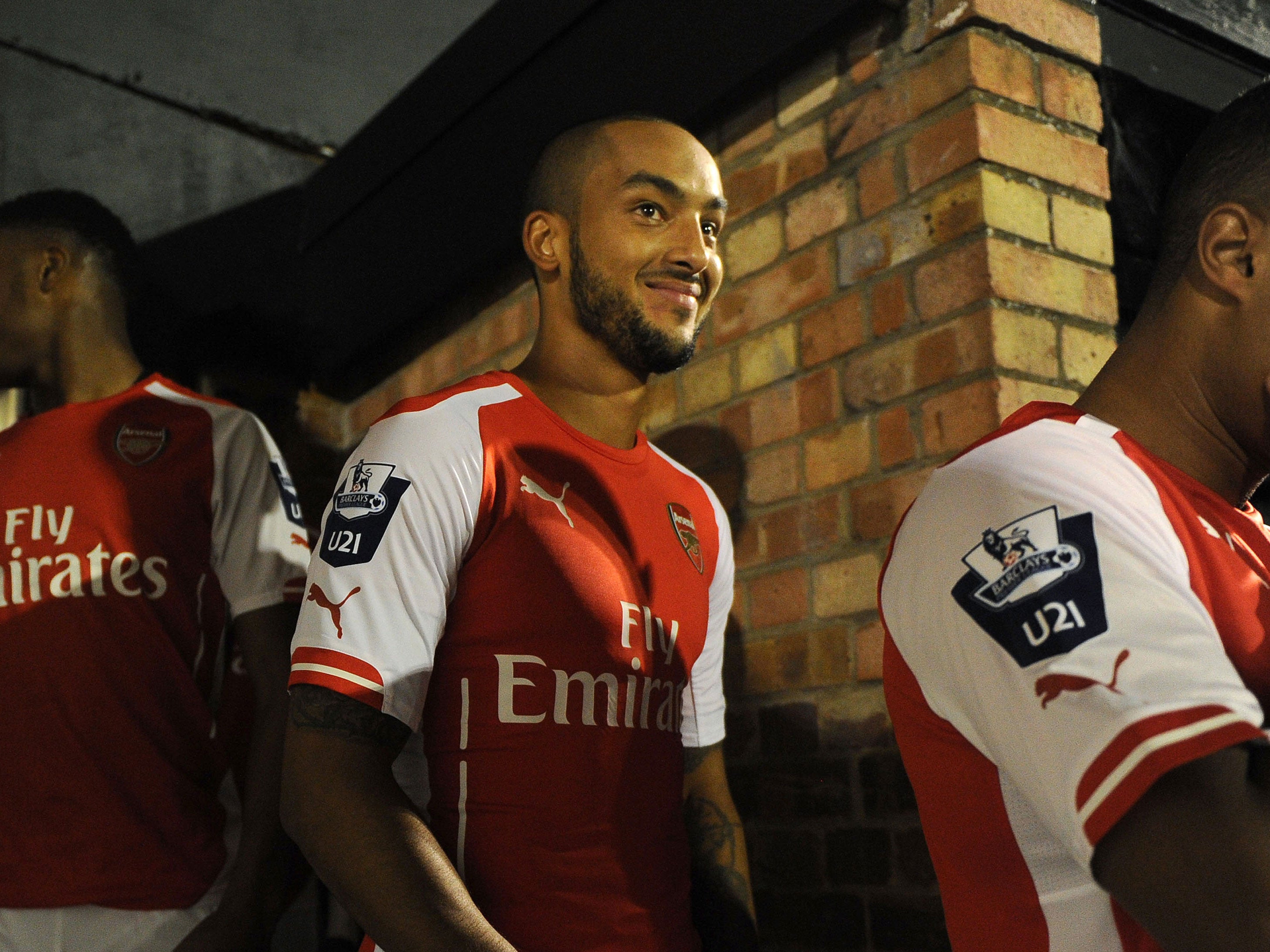 Theo Walcott looked very pleased to back playing again