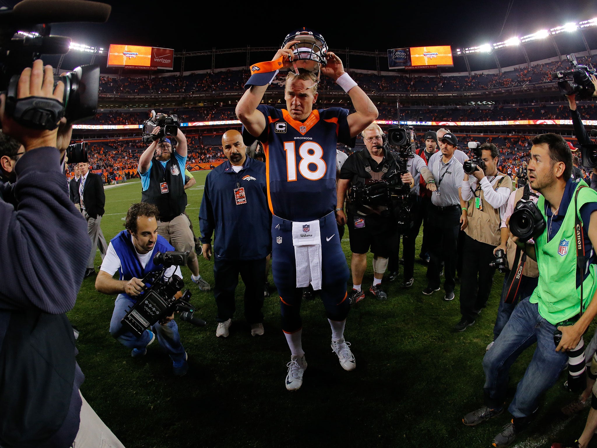 Peytonm Manning walks off the field following the Denver Broncos victory over the San Francisco 49ers