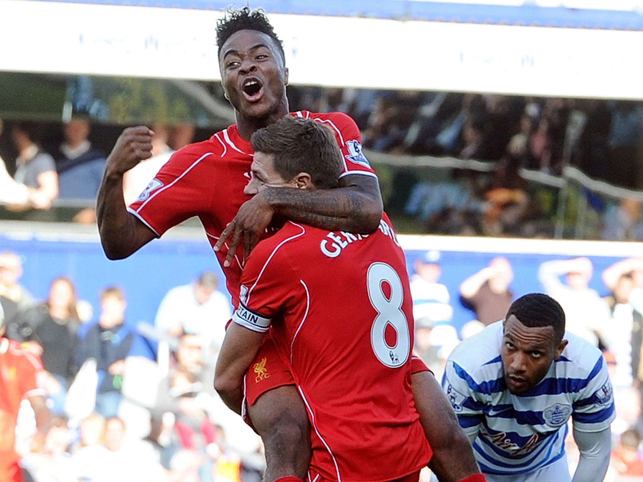 Raheem Sterling and Steven Gerrard celebrate a goal for Liverpool