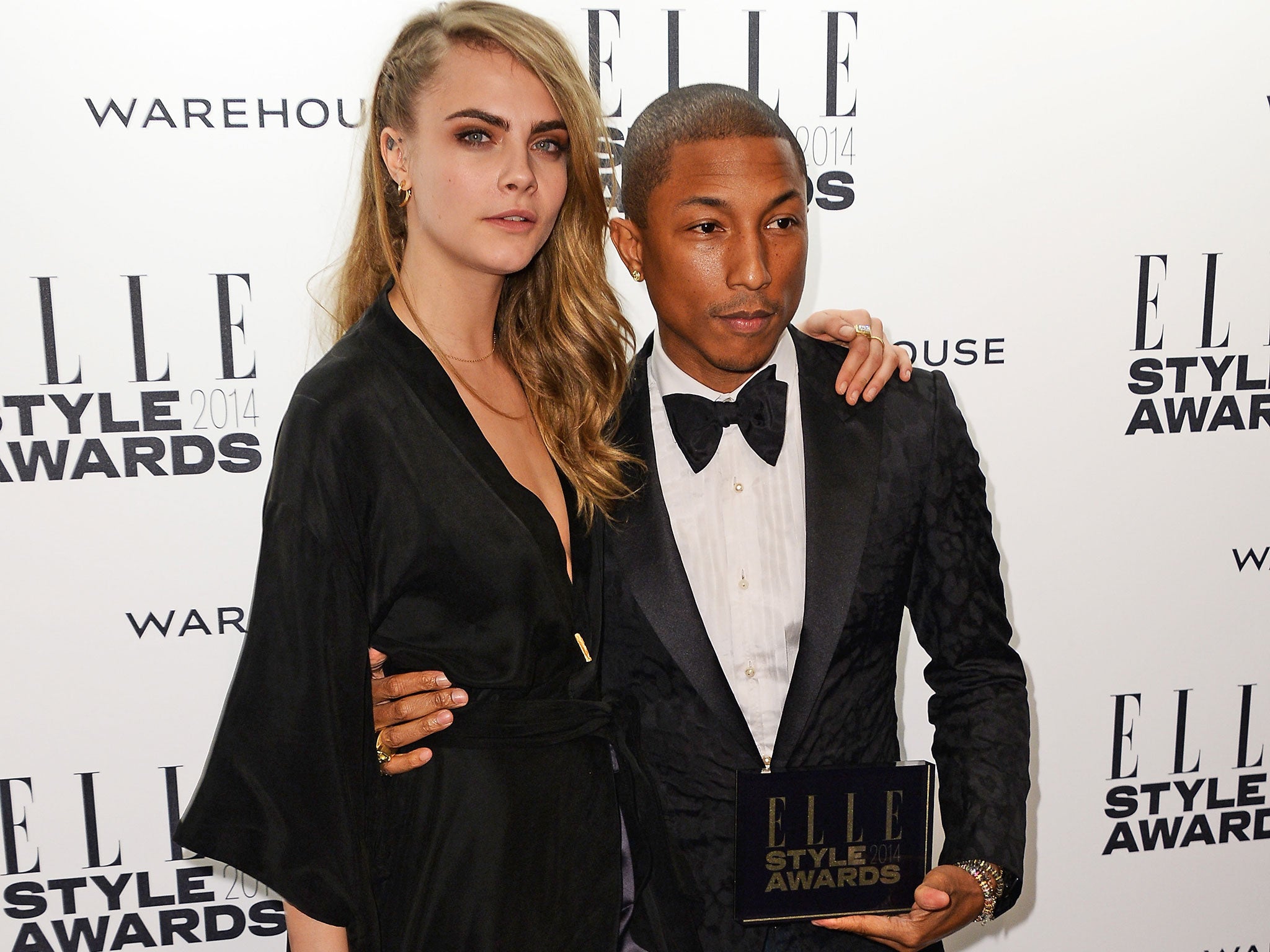 Cara Delevinge and Pharrell Williams pose in the winners room at the Elle Style Awards 2014