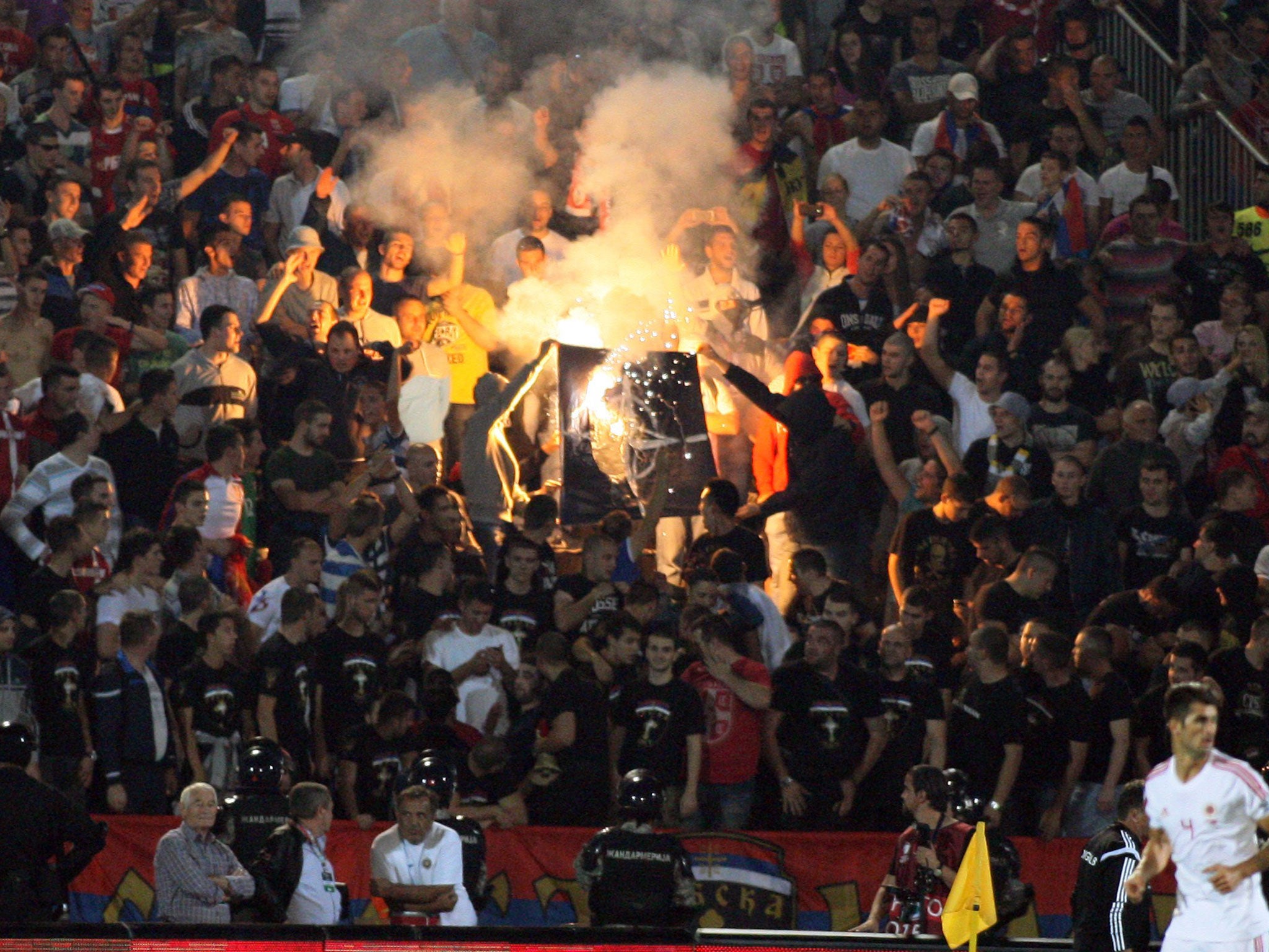 The match at Partizan Belgrade’s stadium had to be abandoned after a riot broke out involving players, supporters and the police