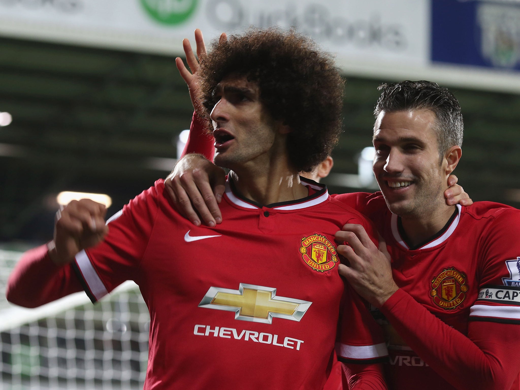 Marouane Fellaini celebrate scoring against West Brom