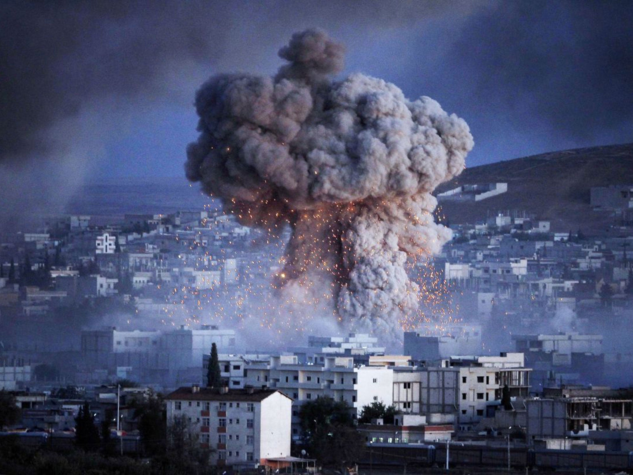 An explosion rocks the Syrian city of Kobani during a reported suicide car bomb attack by Isis on Monday