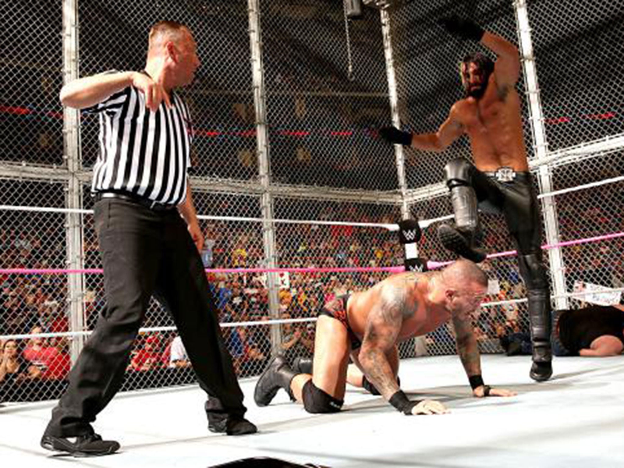 Seth Rollins delivers a curb-stomp to his fellow Authority member Randy Orton