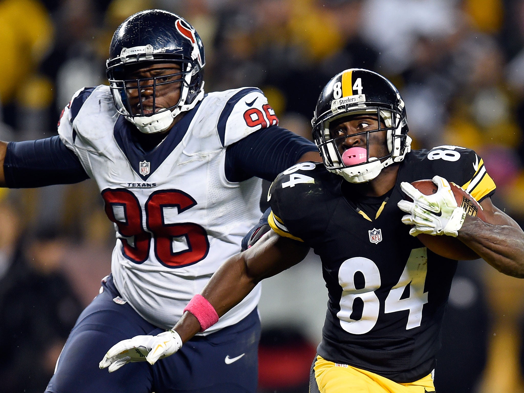 Antonio Brown looks to run free under the attentions of the Texans defence