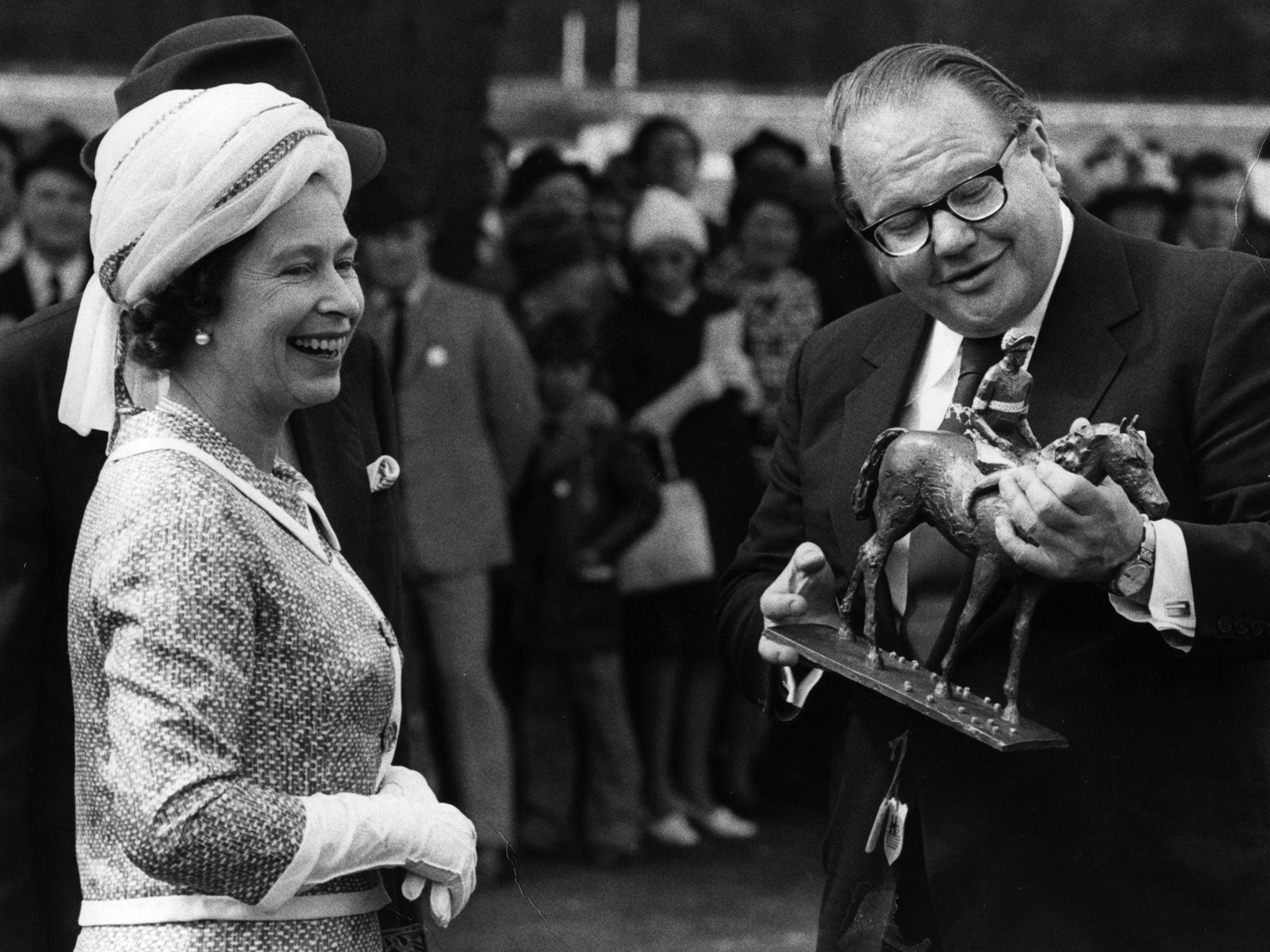 Nelson Bunker Hunt is awarded the winner's trophy after a victory for one of his horses in 1974