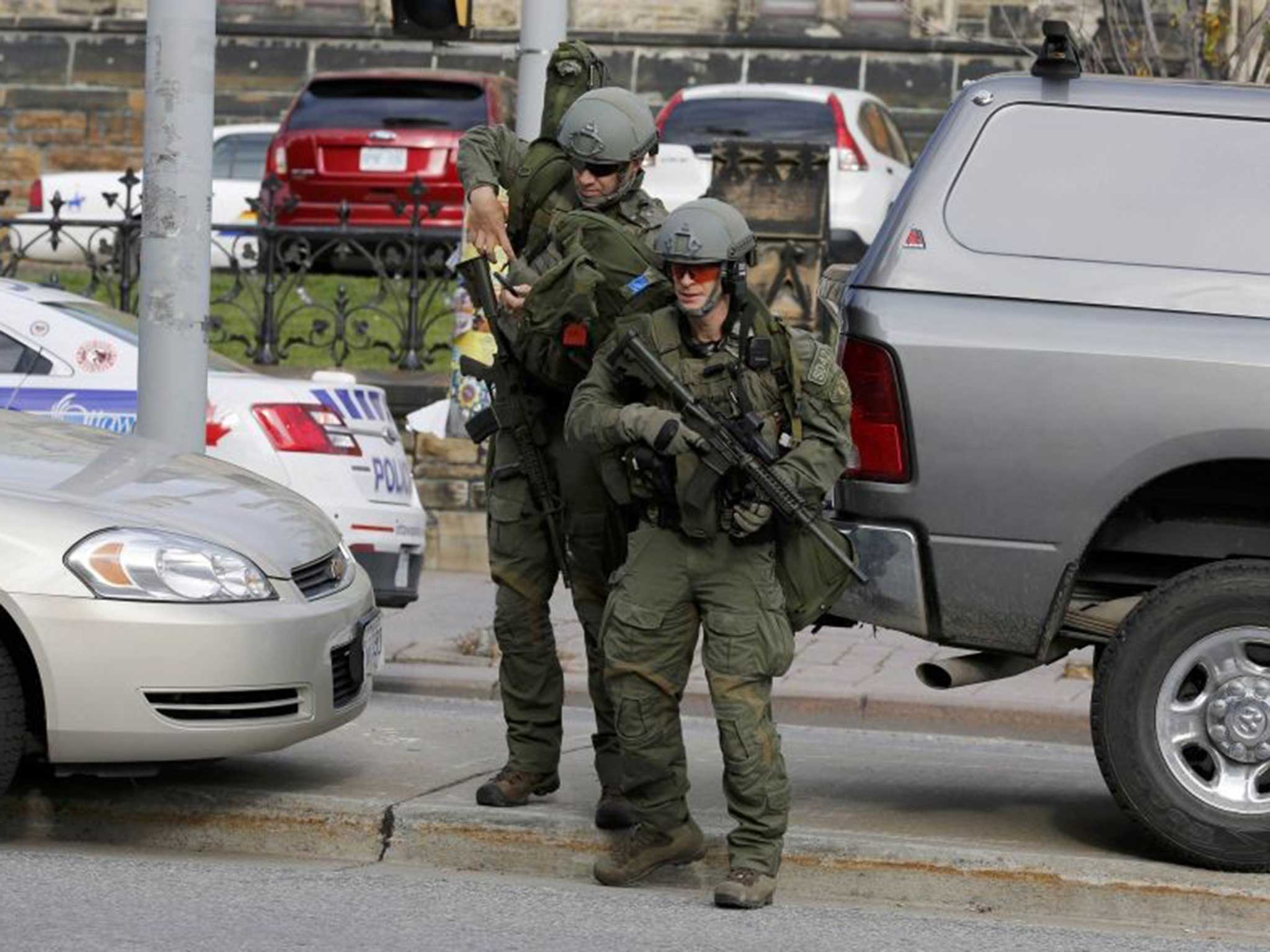 Soldiers arrive on the scene as news spreads the gunman has infiltrated the parliament building