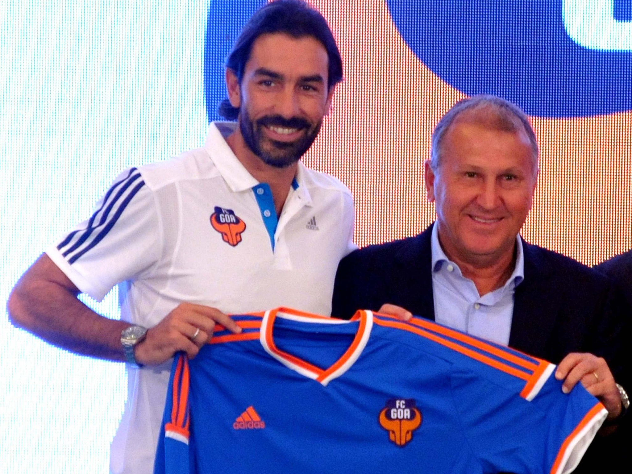Goa Football Club coach Zico (R) and player Robert Pires