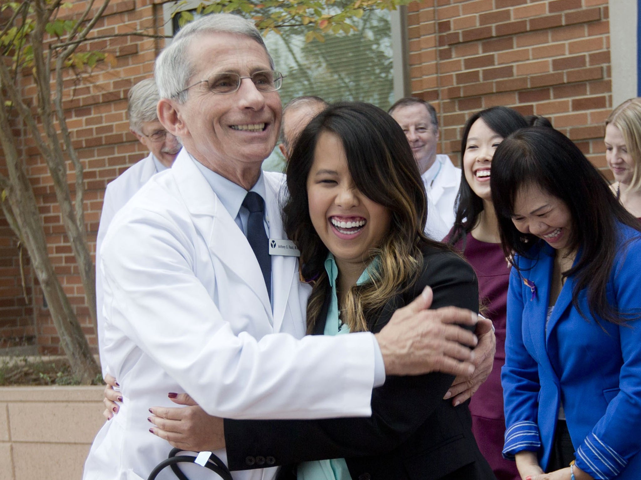 Nina Pham is hugged by Dr Anthony Fauci, director of the National Institute of Allergy and Infectious Diseases