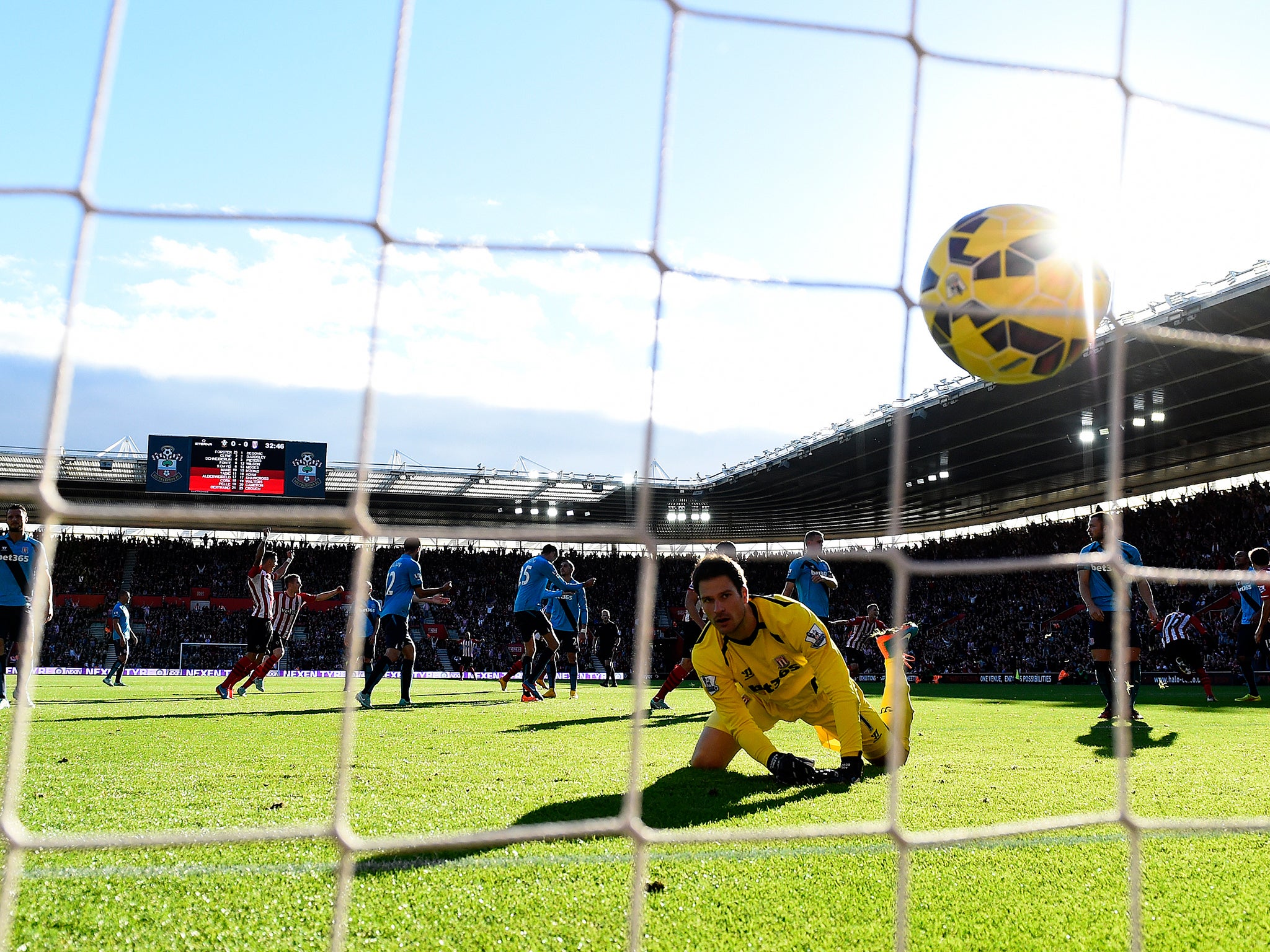 Asmir Begovic of Stoke City watches the ball cross the line as Sadio Mane of Southampton scores the opening goal