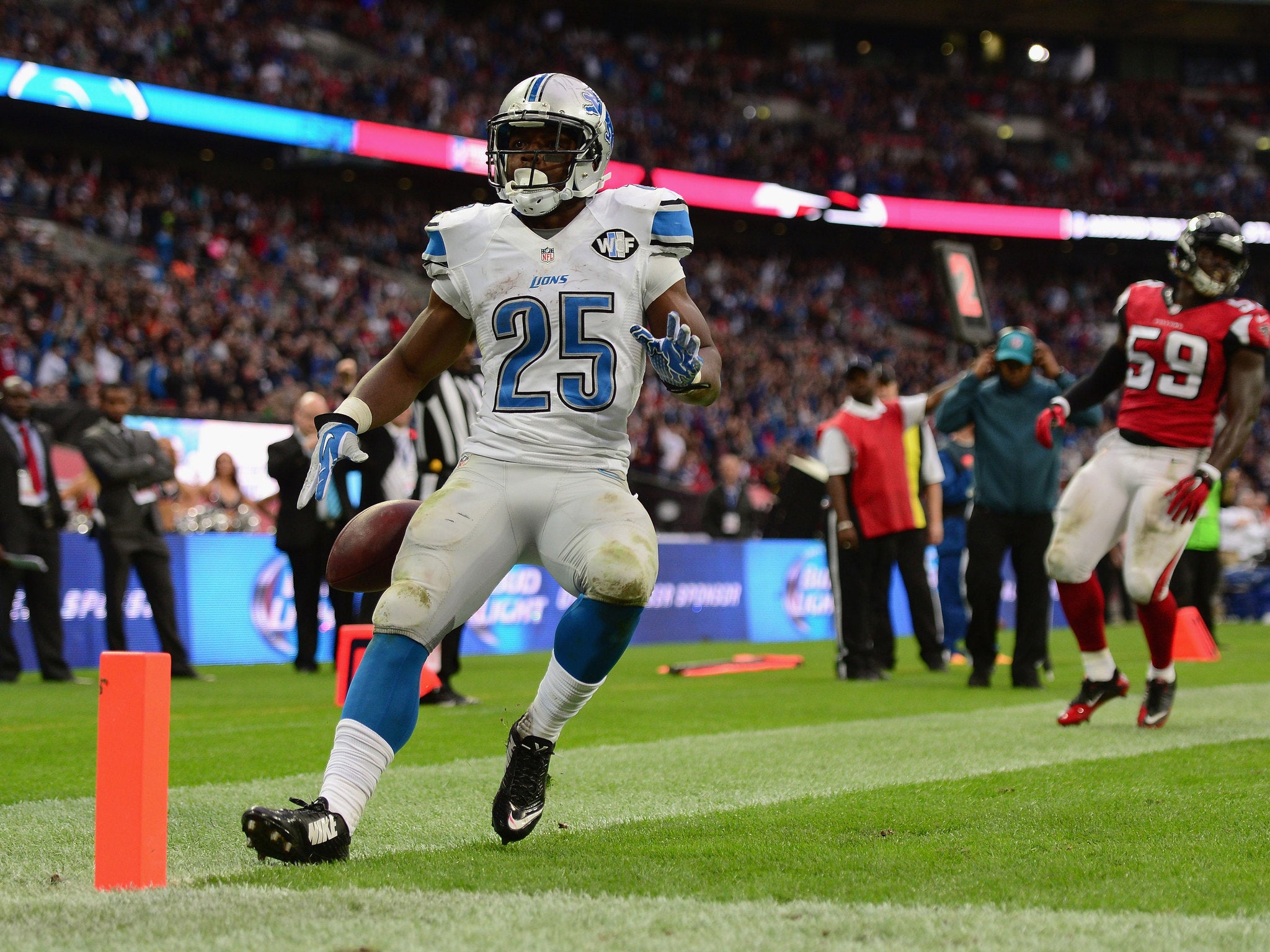 Theo Riddick runs in a touchdown for the Lions