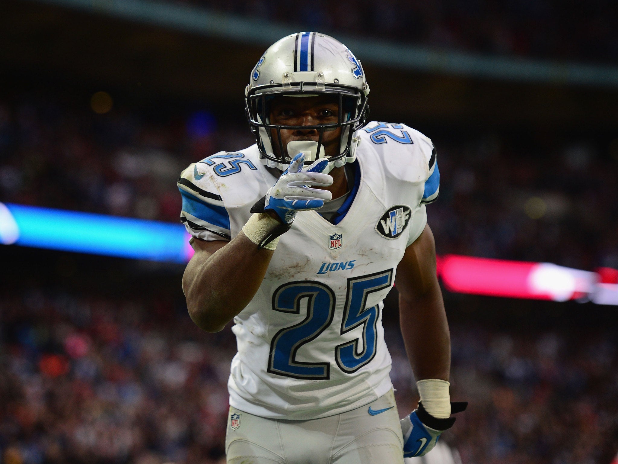 Theo Riddick celebrates his touchdown