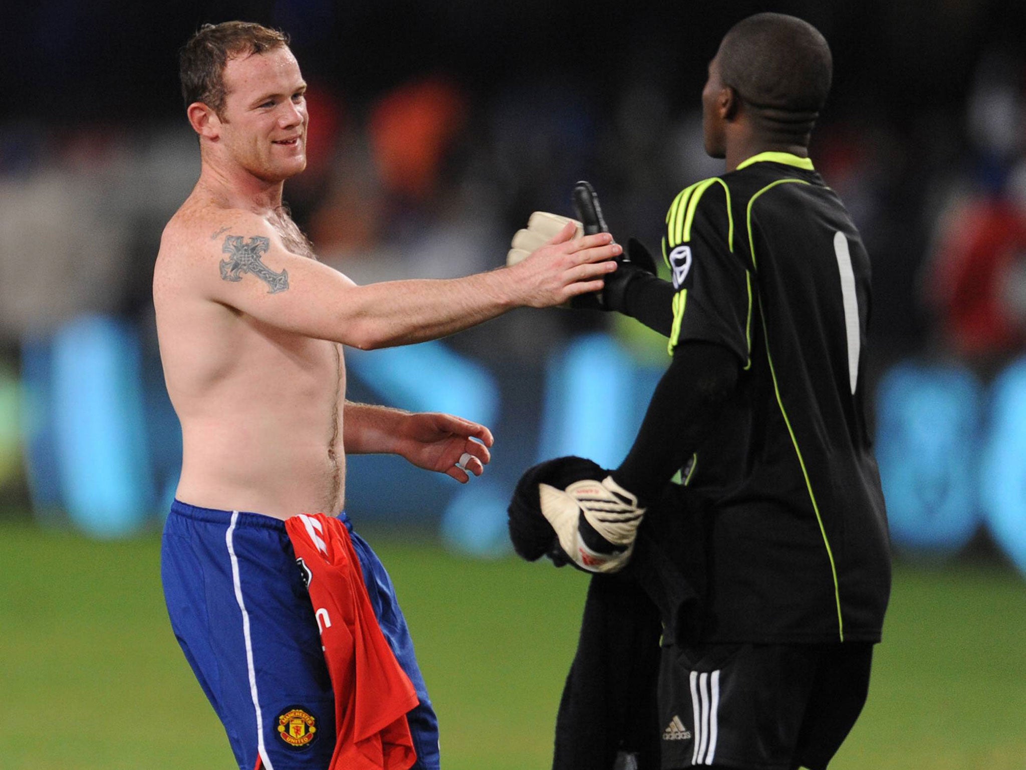 Wayne Rooney faced Senzo Meyiwa during a pre-season match between Manchester United and Orlando Pirates