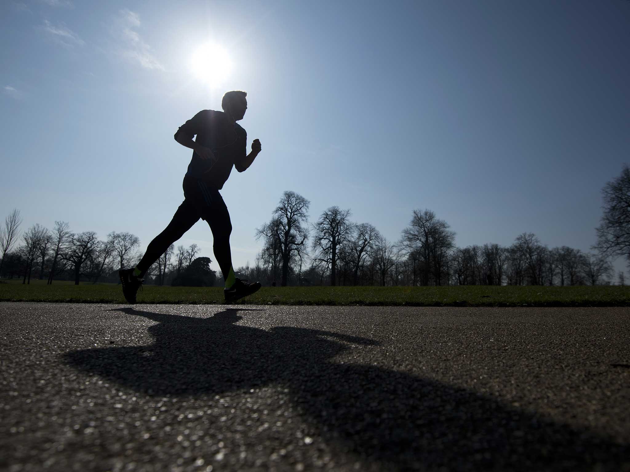 A man runs through Kensington Park Gardens as Londoners wake up to a week of sunshine last month