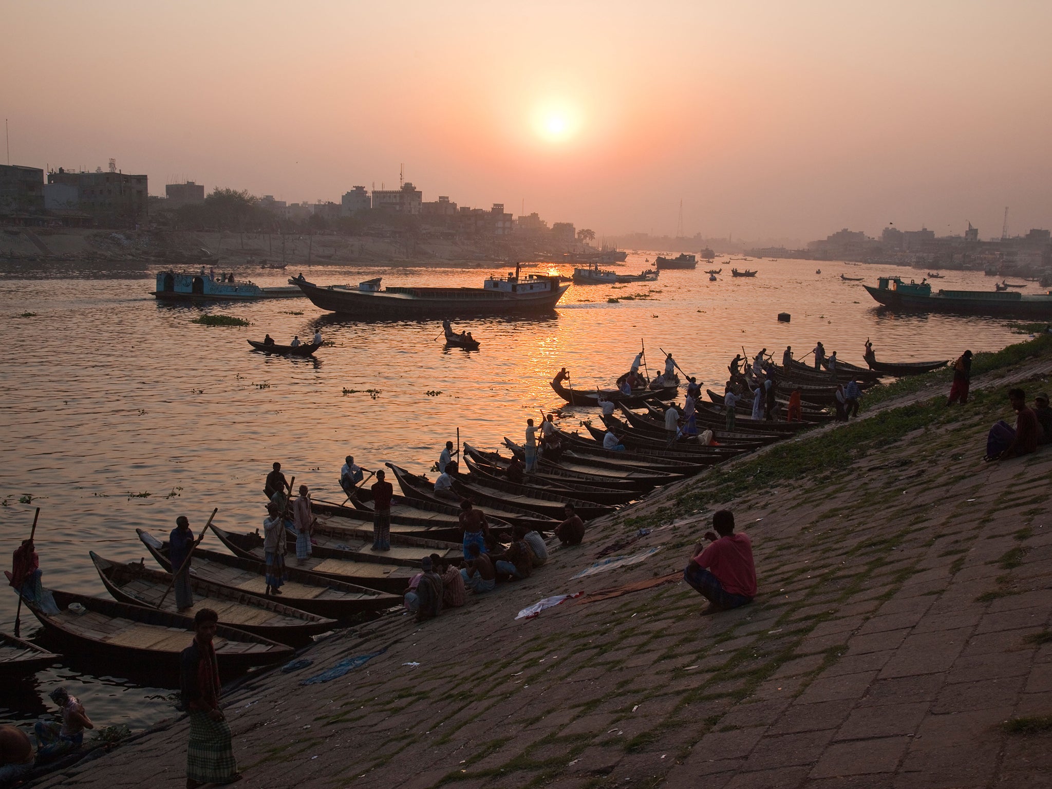 Nouka dingi or small rowboat taxis on the Buriganga River in Dhaka Bangladesh