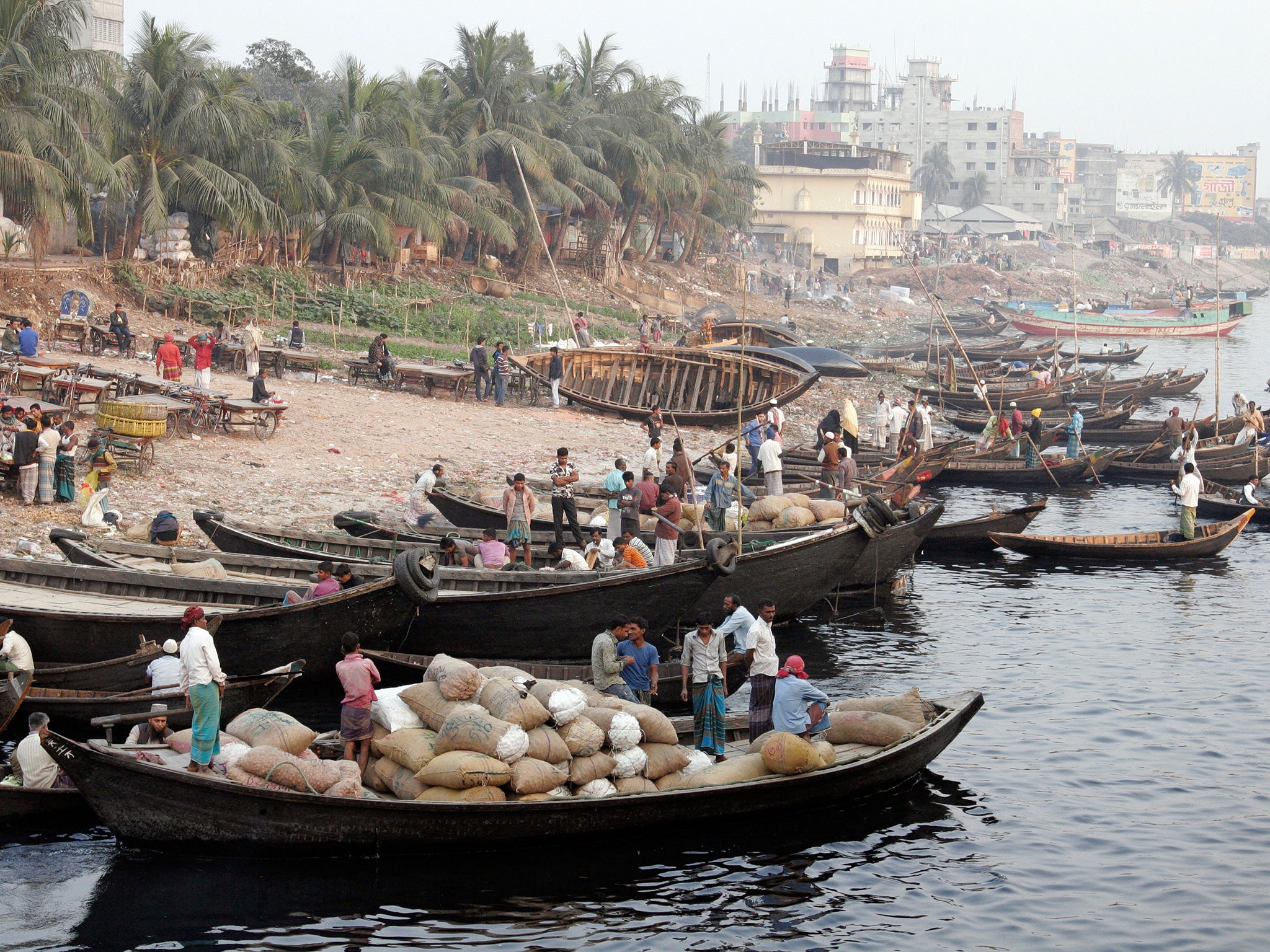 Buriganga river bank with small row boats in Dhaka, Bangladesh