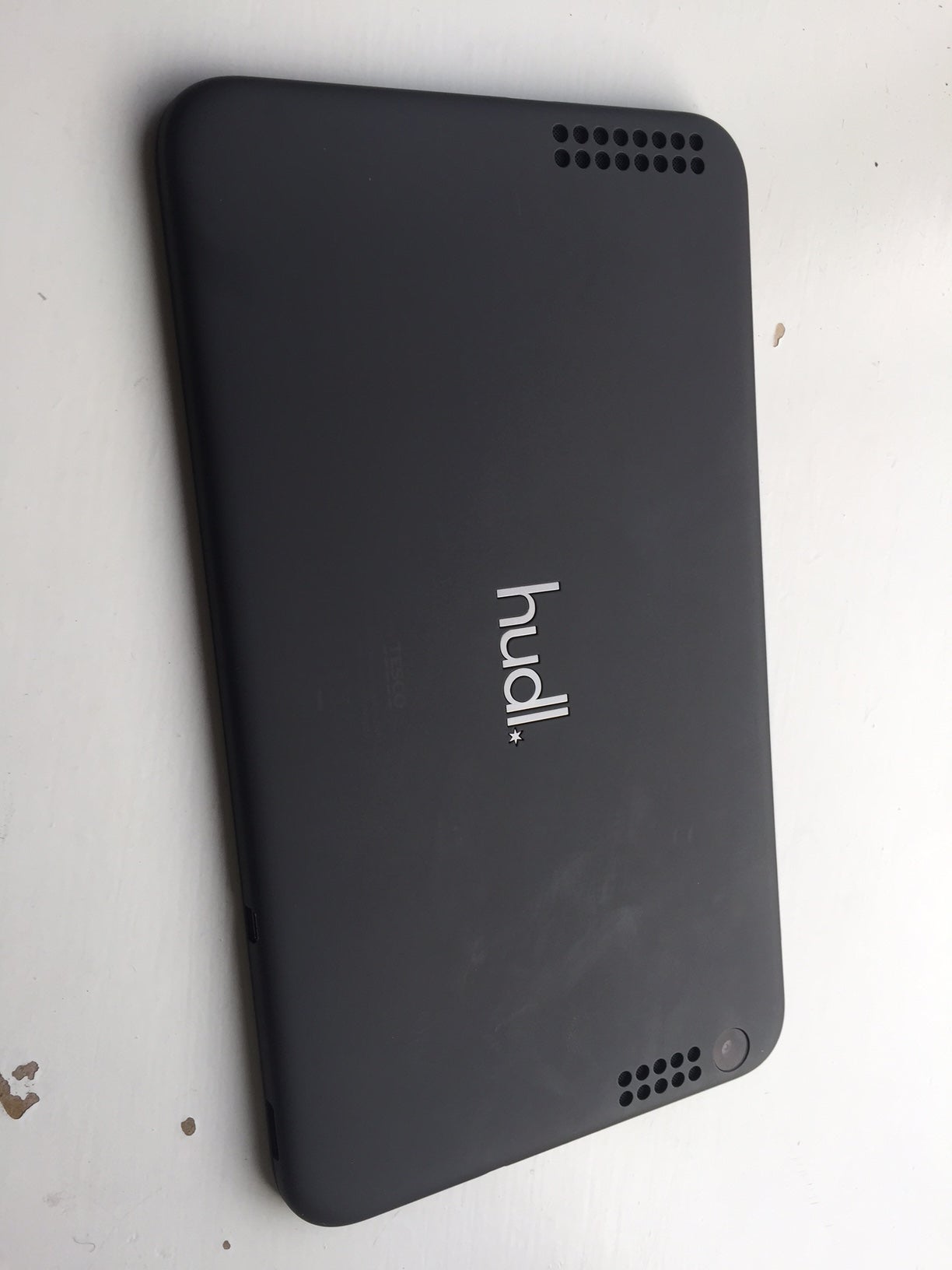 The rear of the Hudl 2: grippable plastic, but smudgy and with ugly speaker grilles.