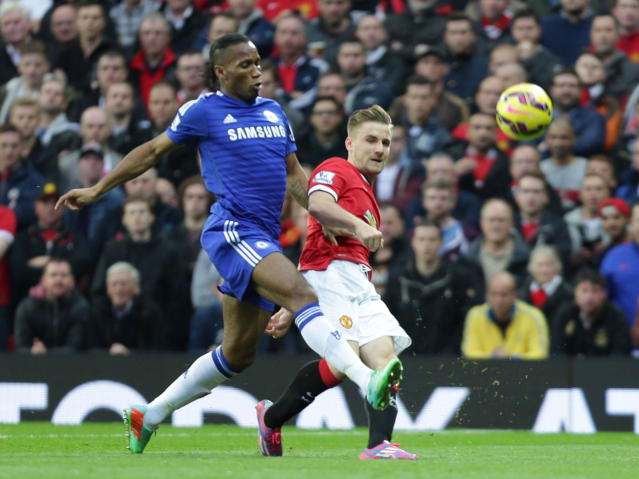 Luke Shaw challenges Didier Drobga