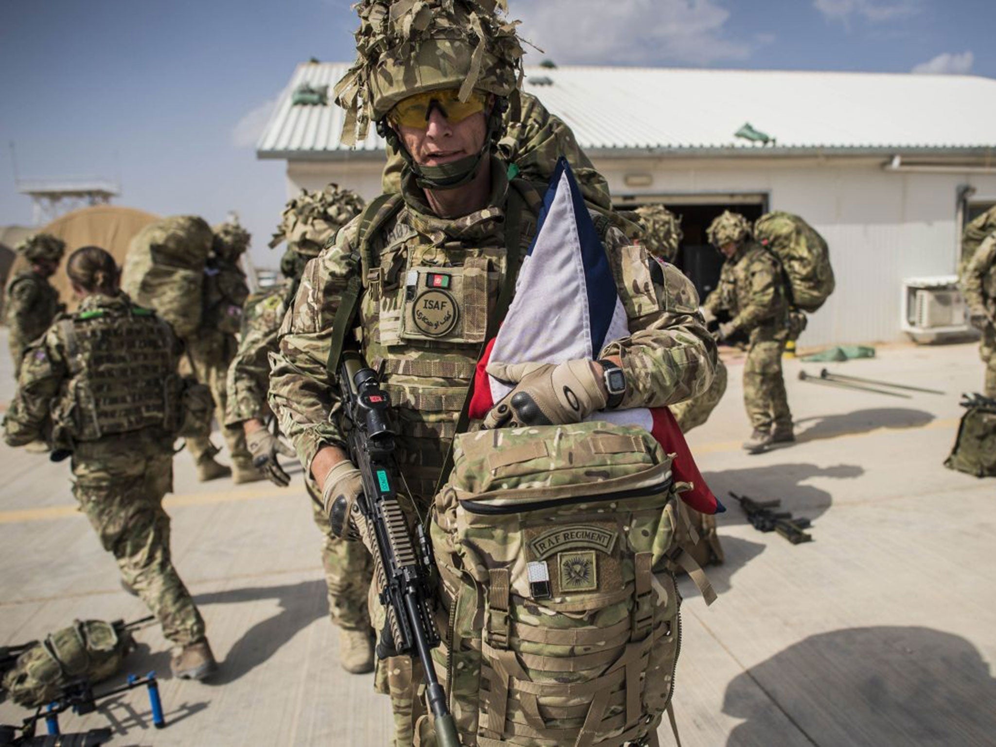 Wing Commander Matt Radnall as he prepared to board the last Chinook helicopter to leave Camp Bastion