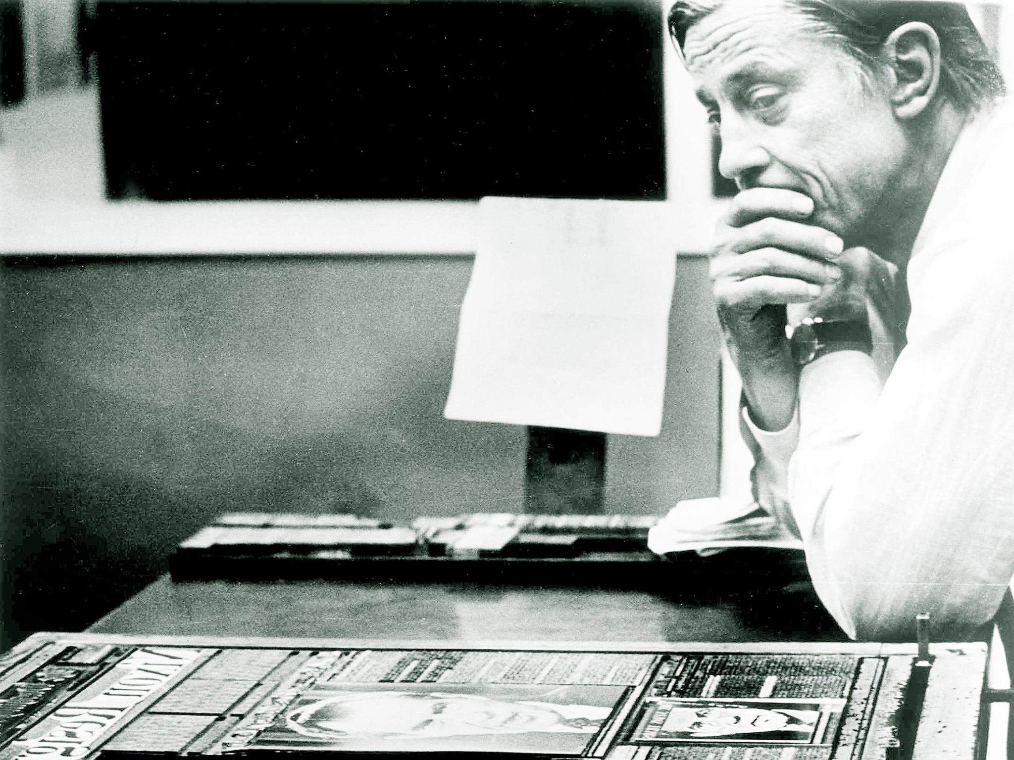 Ben Bradlee in the composing room of The Washington Post in 1974, looking at A1 of the first edition of the newspaper, headlined 'Nixon Resigns'.