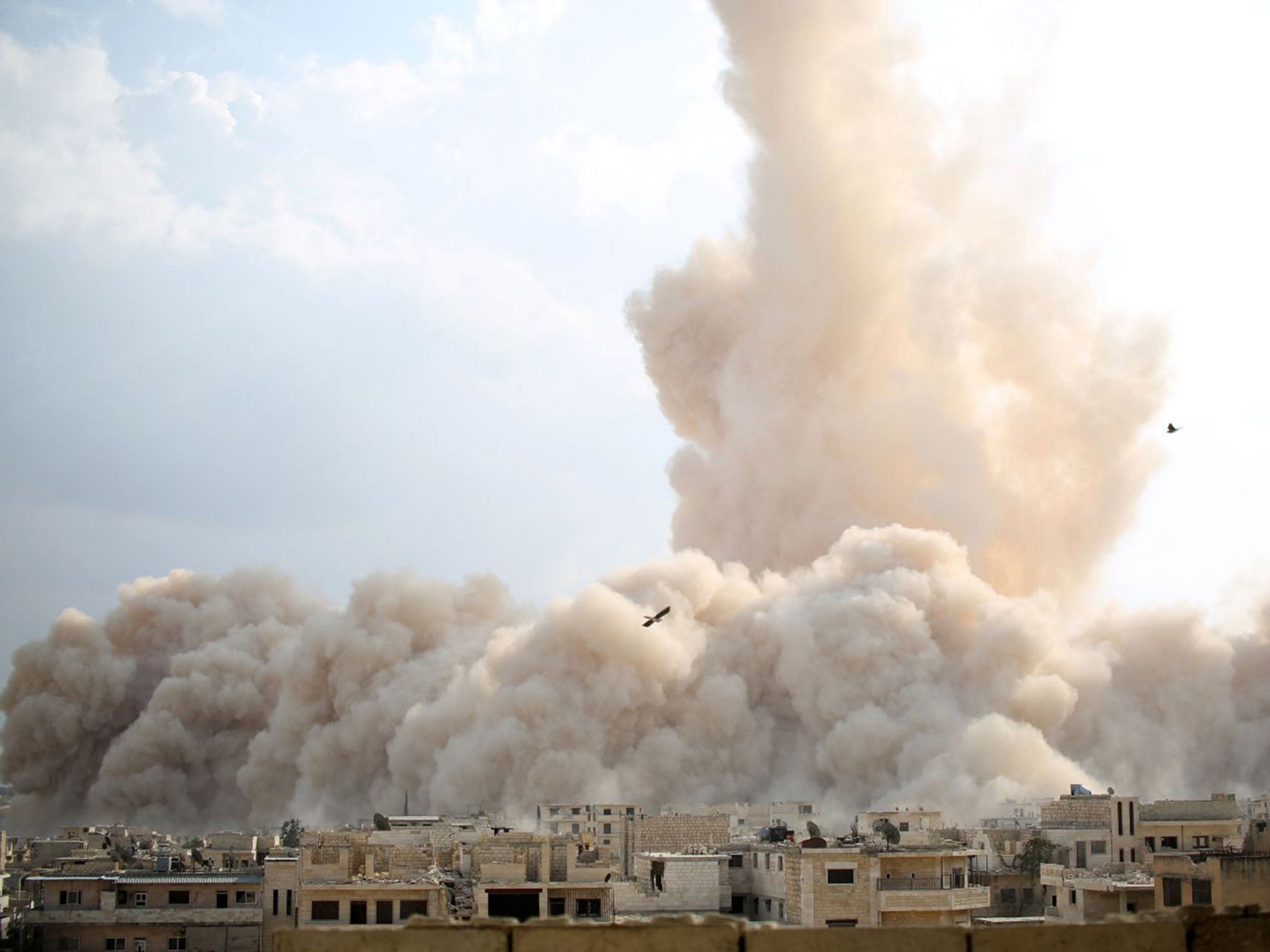 An explosion hitting a Syrian army military outpost in Idlib province last year