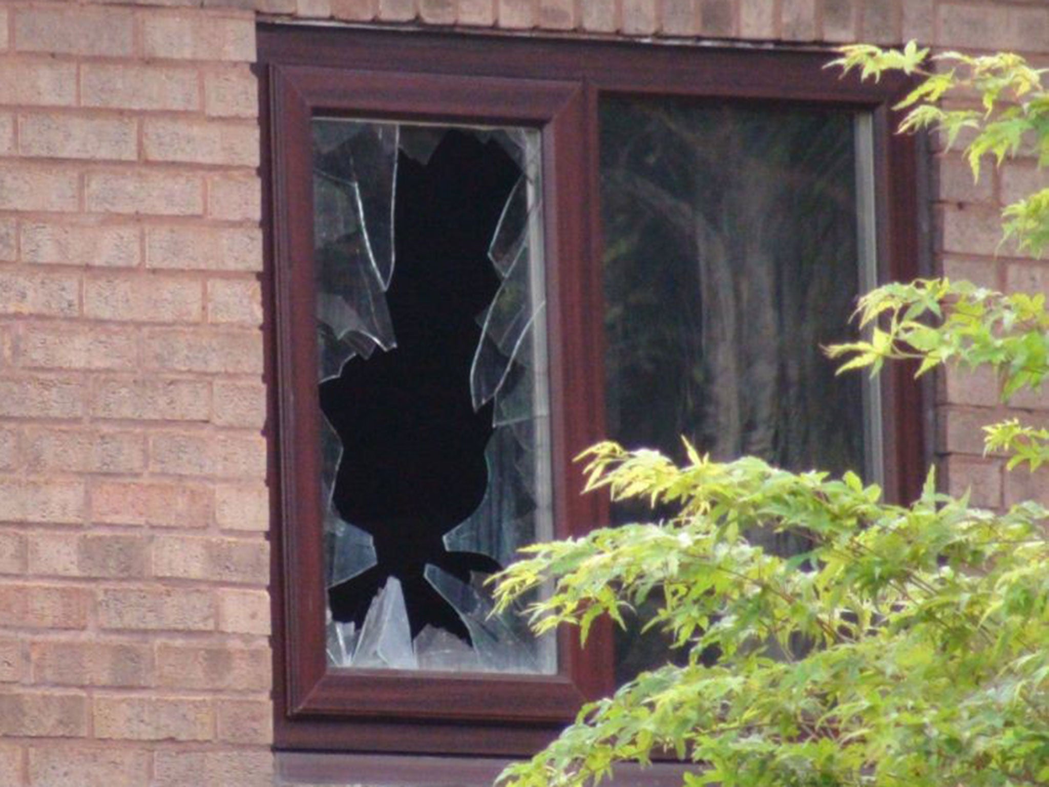 A damaged window on the house in Tennyson Close, Peniston