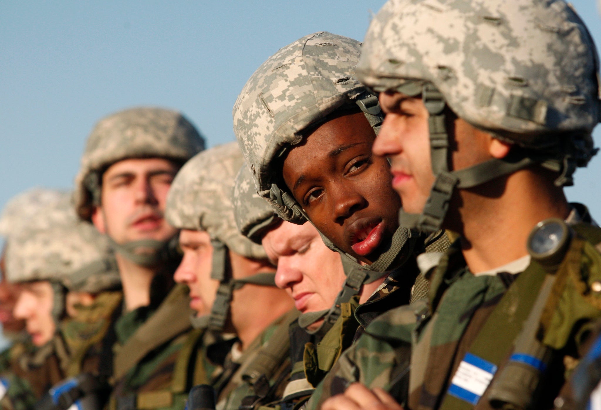 A U.S. Army recruit looks at his "battle buddy" during basic training at the Fort Sill Army Post in Fort Sill, Oklahoma November 5, 2009.