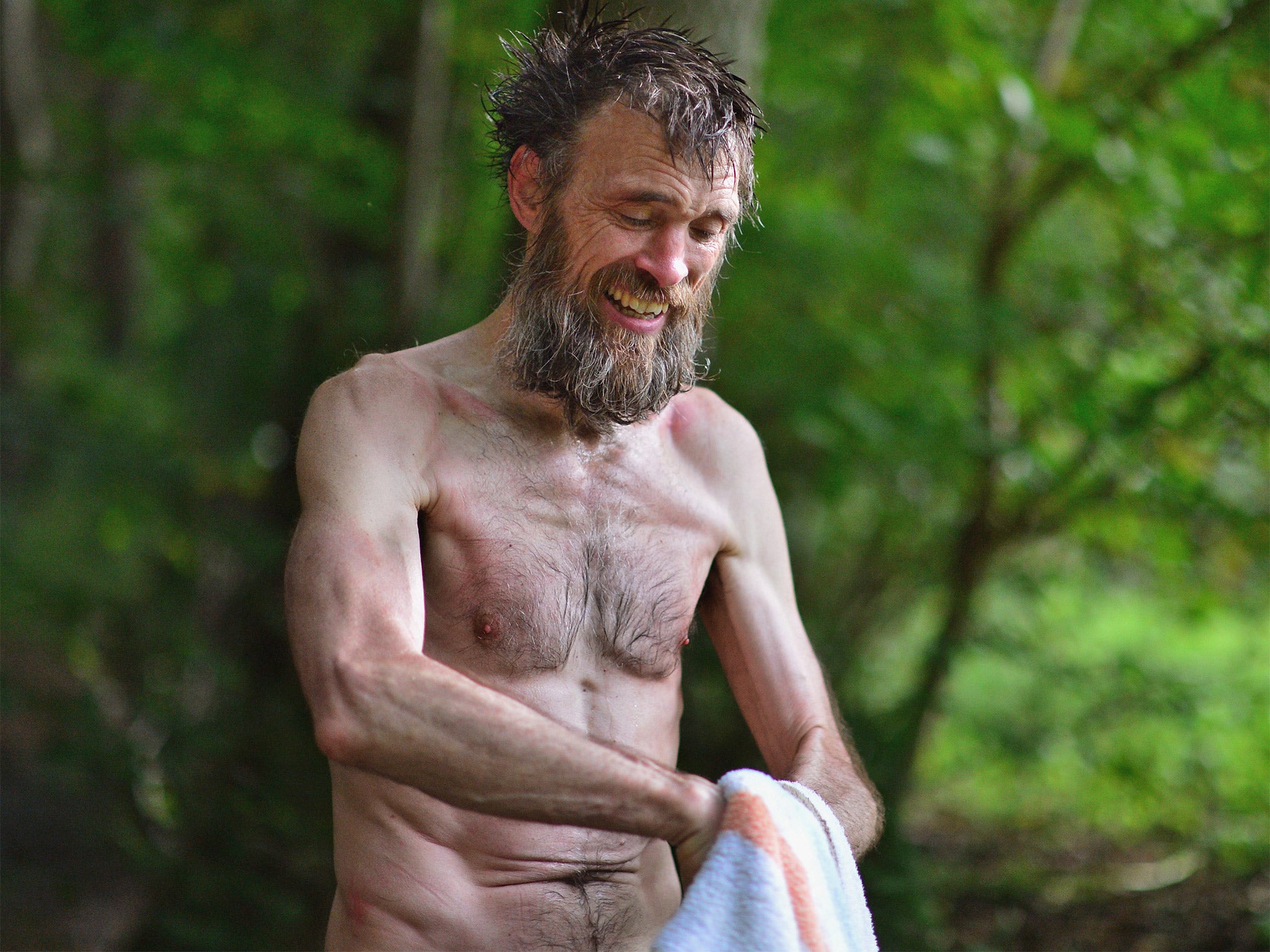 Stephen Gough bathes in a burn outside Peebles in the Scottish Borders, in 2012 (Getty)