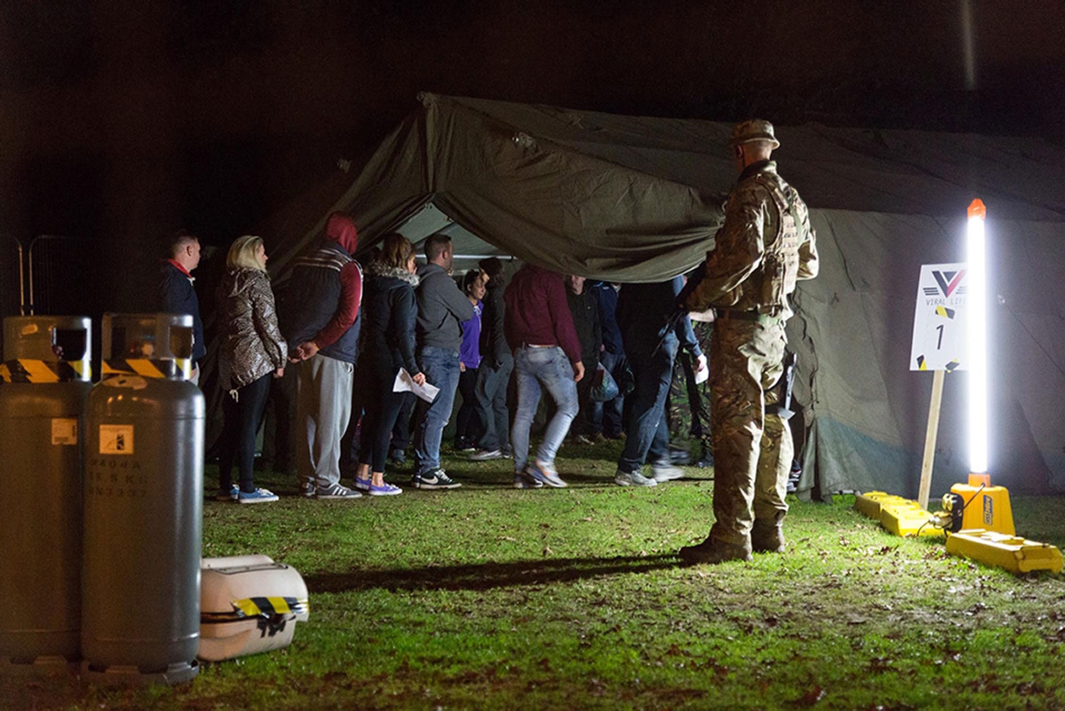 Participants line up for the Outbreak Brighton immersive Halloween horror experience