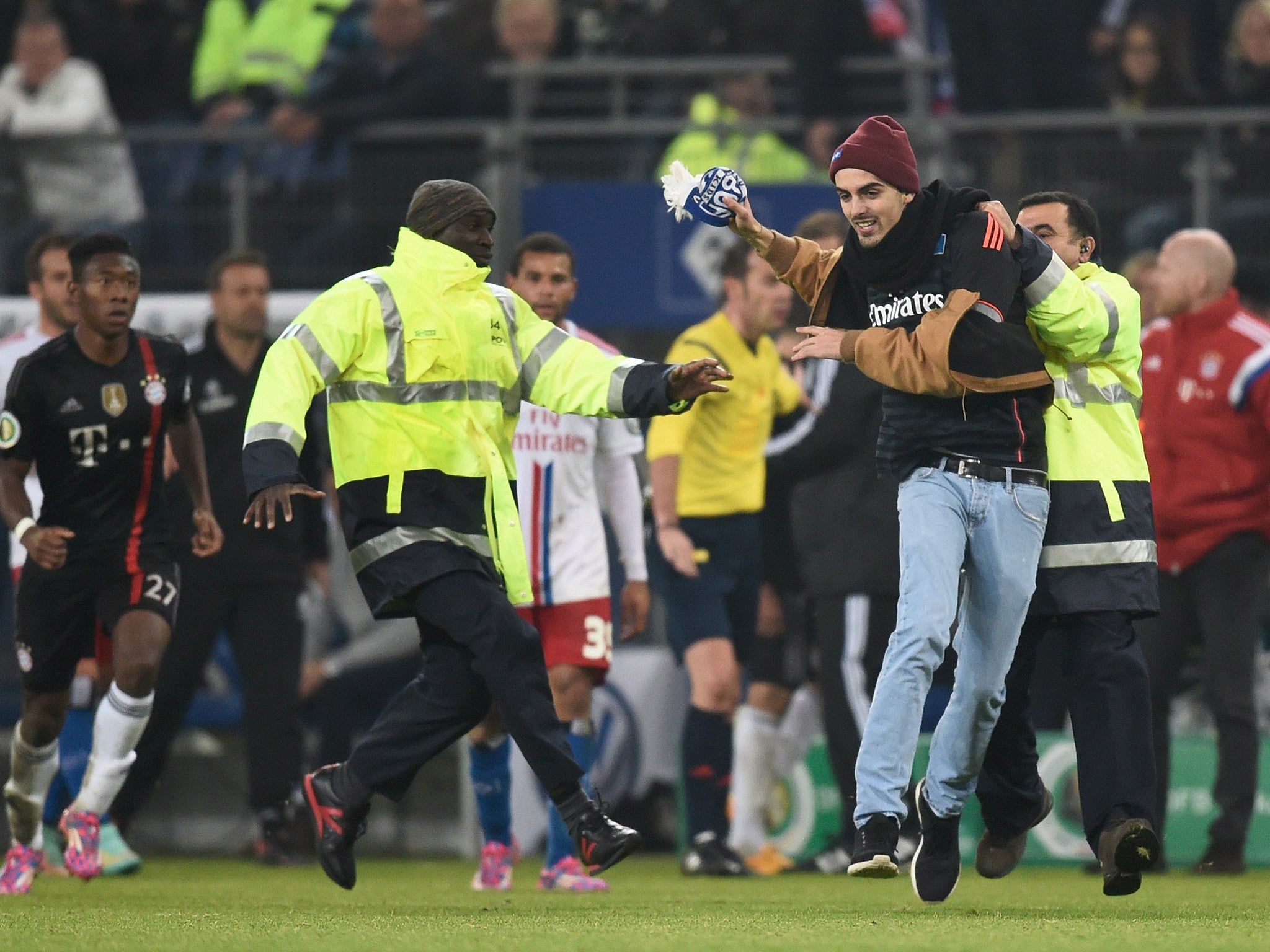 The pitch invader is led away