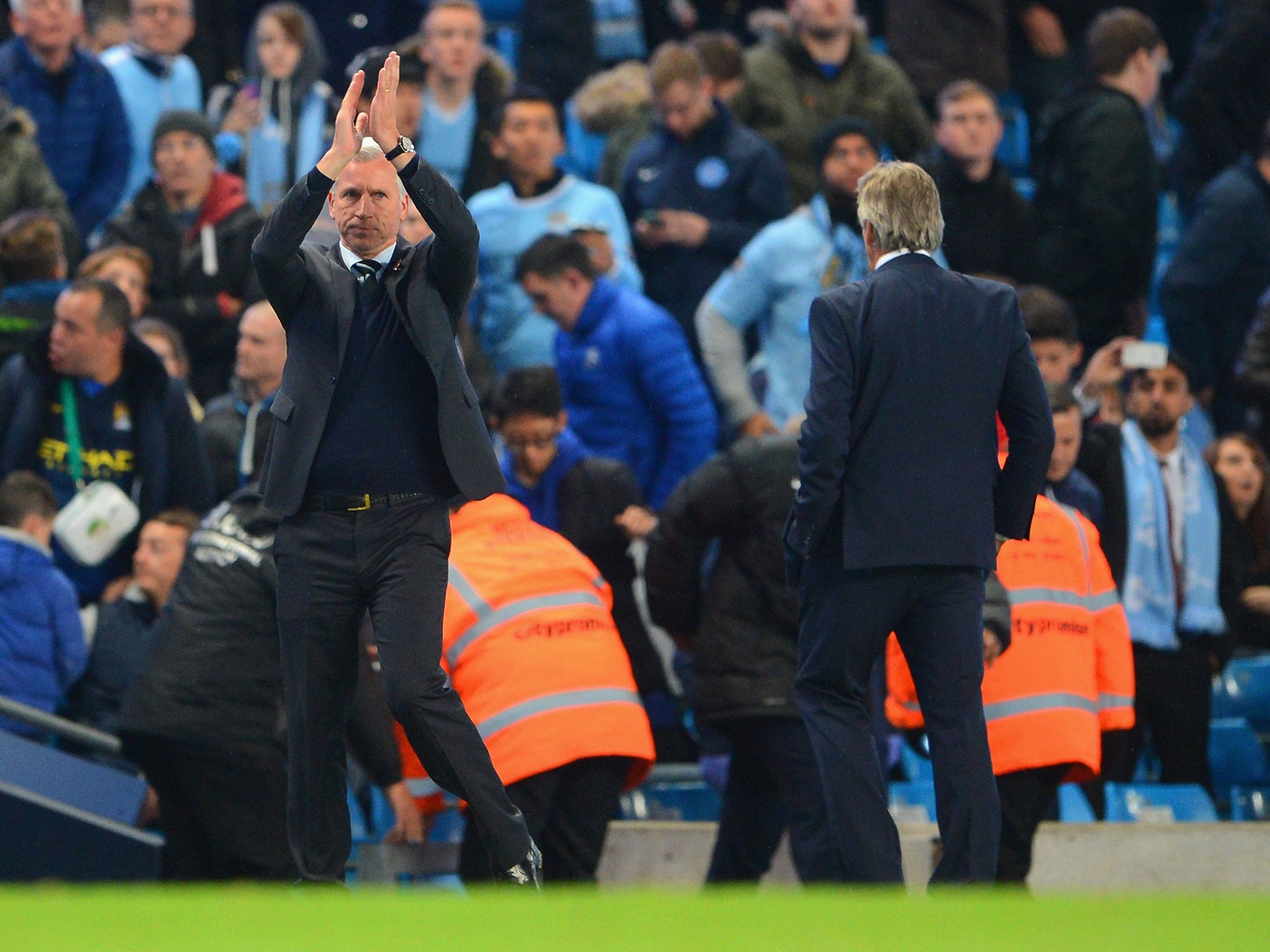 Pardew applauds the travelling Newcastle support after the 2-0 win over City