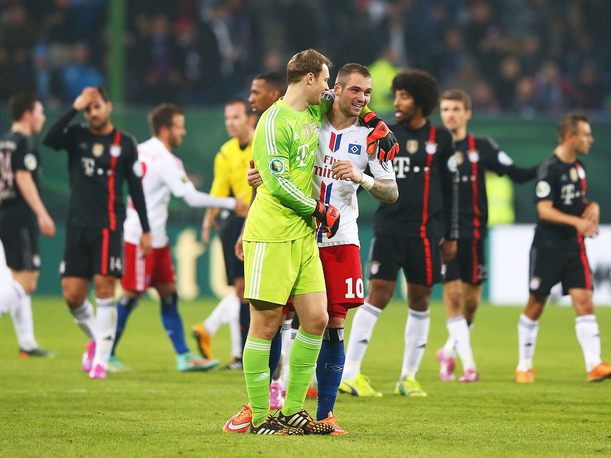 Neuer hugs Lasogga after Bayern Munich's 3-1 win over Hamburg