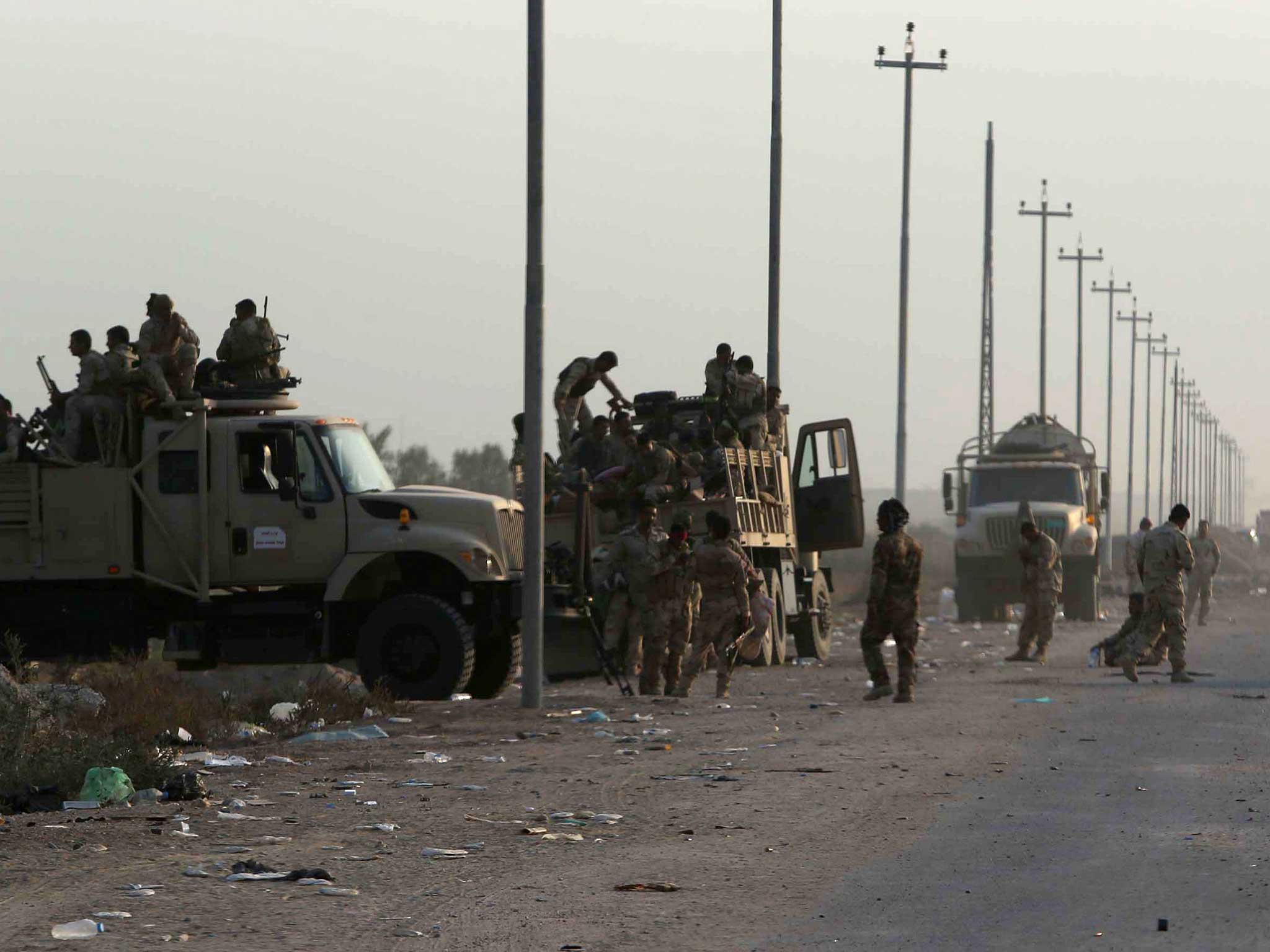 Pro-Iraqi forces regroup south of Baghdad on the route toward Fallujah