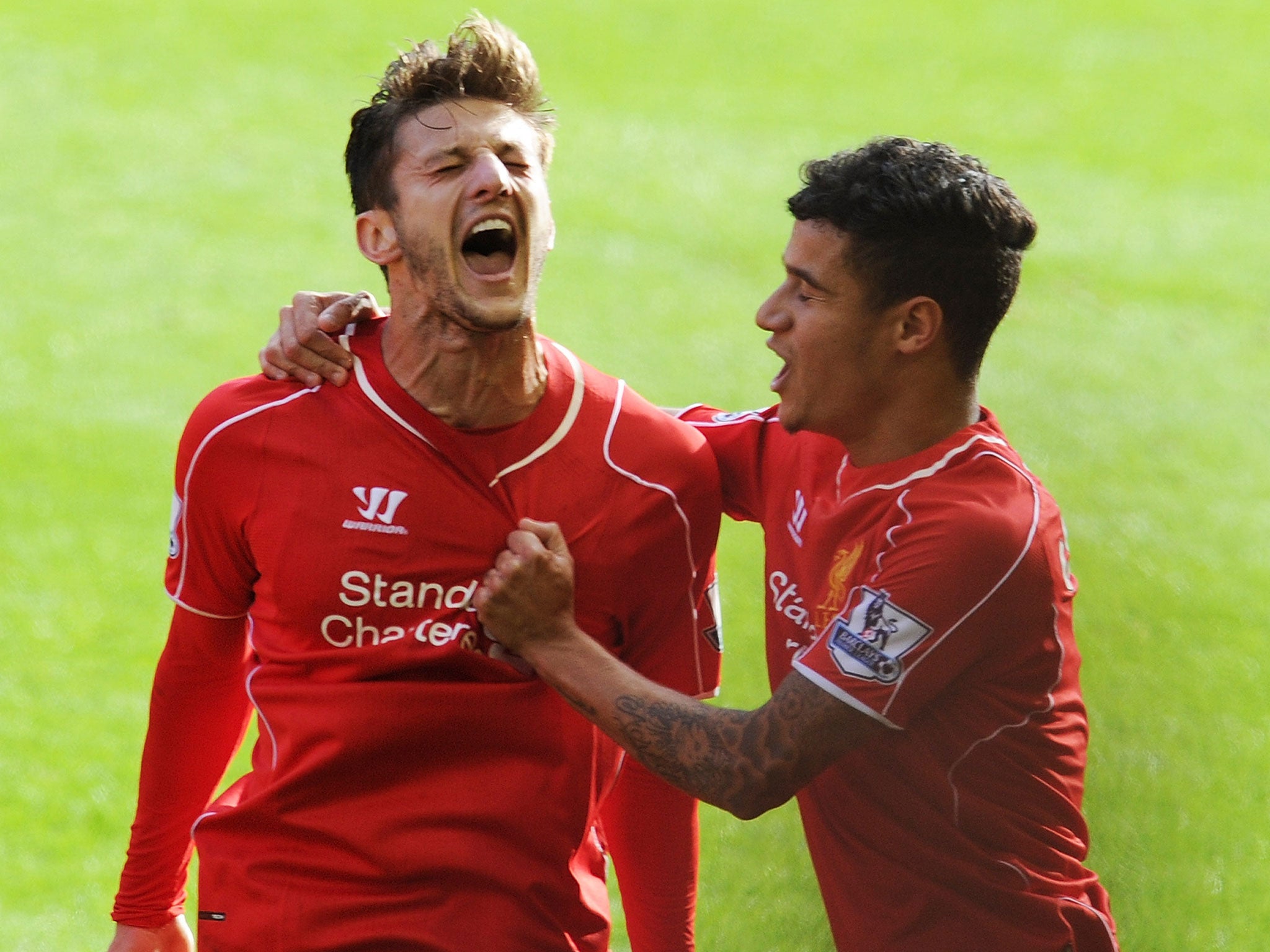 Adam Lallana celebrates scoring for Liverpool