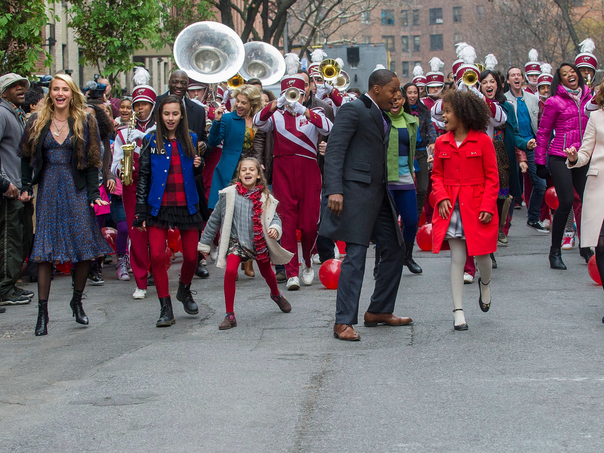 Miss Hannigan (Cameron Diaz), Pepper (Amanda Troya), Mia (Nicolette Pierini), Mrs. Kovacevic (Stephanie Kurtzuba), Stacks (Jamie Foxx), Annie(Quvenzhane Wallis) and Grace (Rose Byrne) sing "Tomorrow" in Columbia Pictures' Annie