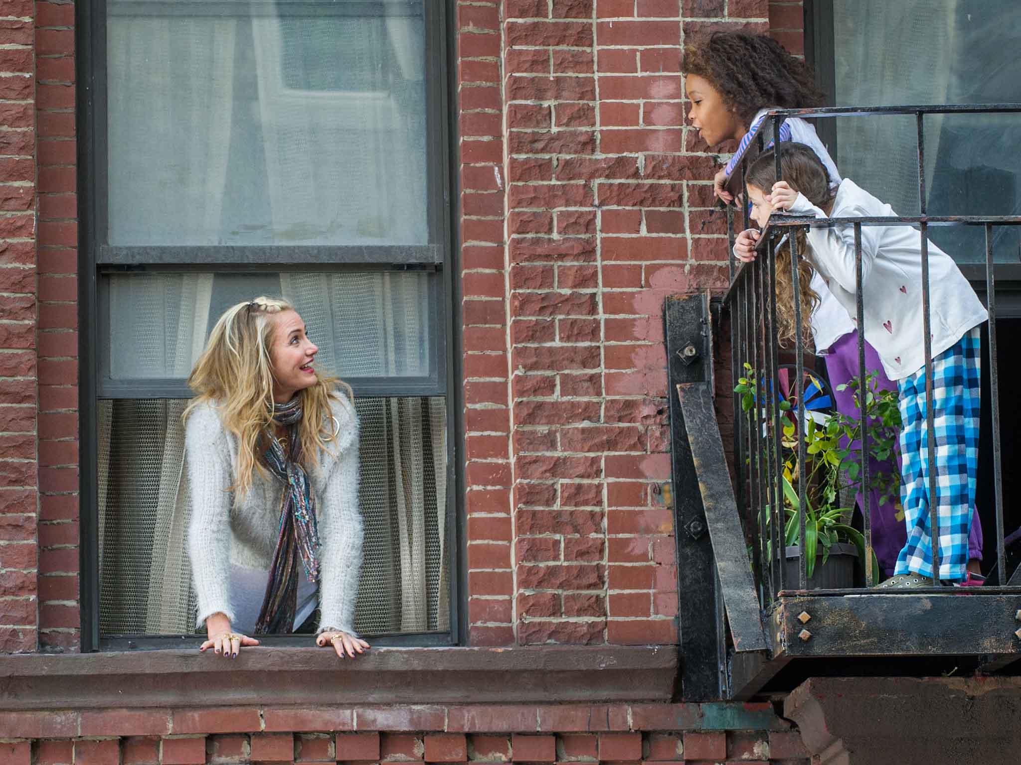 Miss Hannigan (Cameron Diaz), with Annie (QuvenzhanÈ Wallis) and Mia (Nicolette Pierini) in Columbia Pictures' ANNIE.