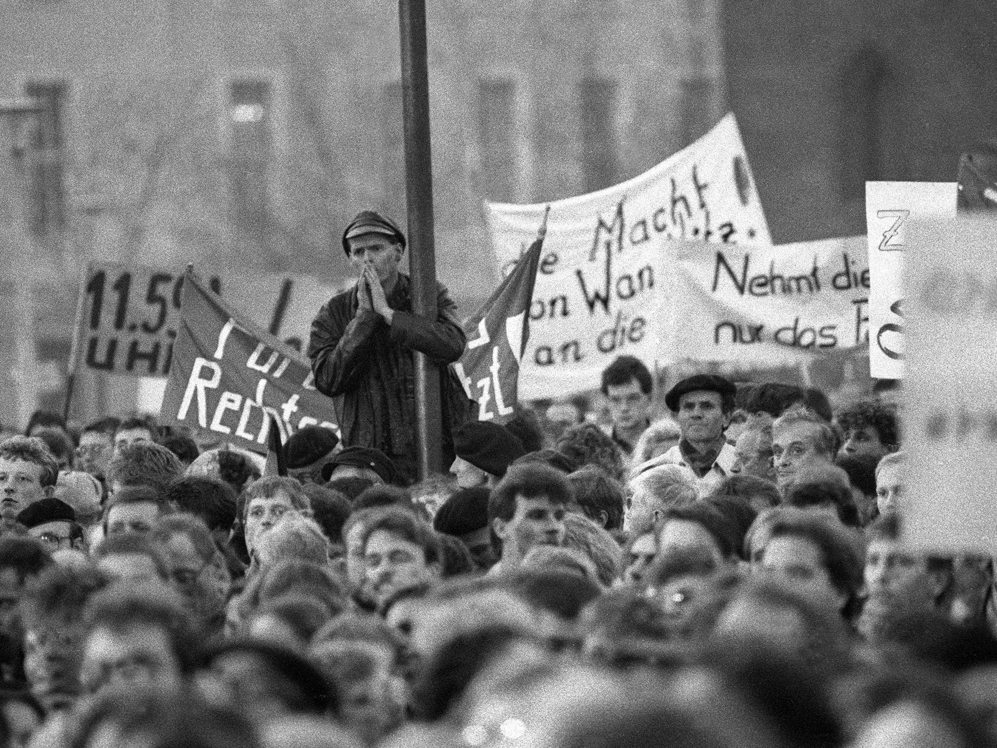 A protest outside the DDR parliament on 7 November 1989 calling for the Wall to come down. It did so two days later