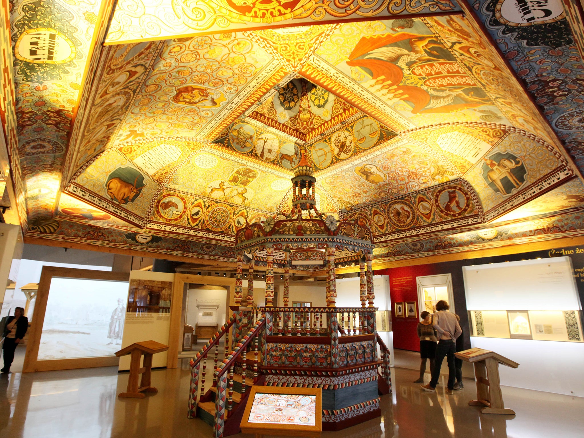 Visitors stand under the "Celestial Canopy"