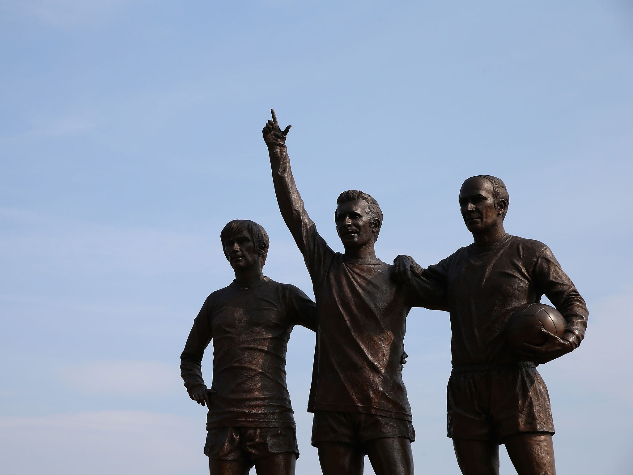 The statues of Denis Law, George Best and Bobby Charlton stand tall outside Old Trafford